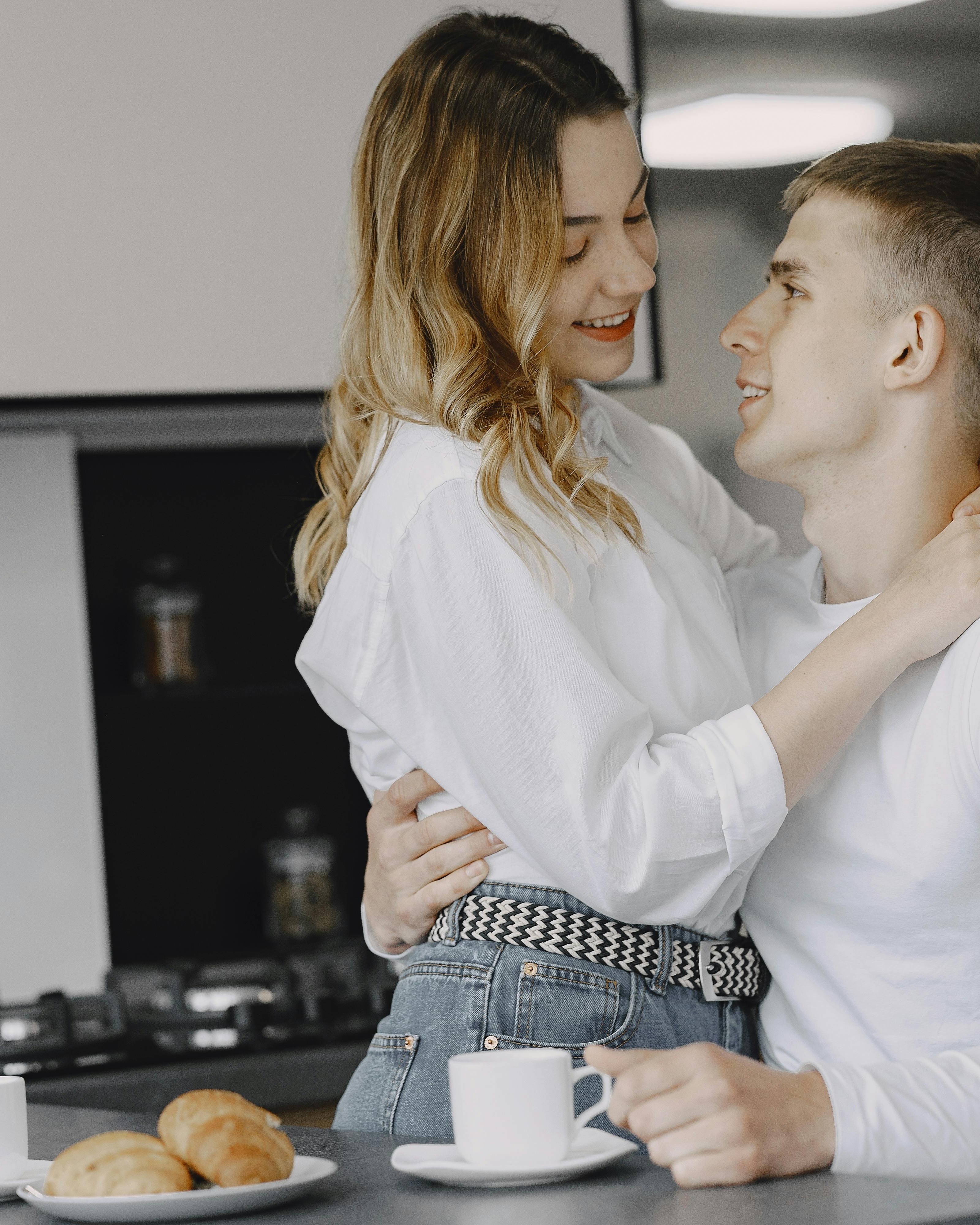 Couple Embracing During Breakfast