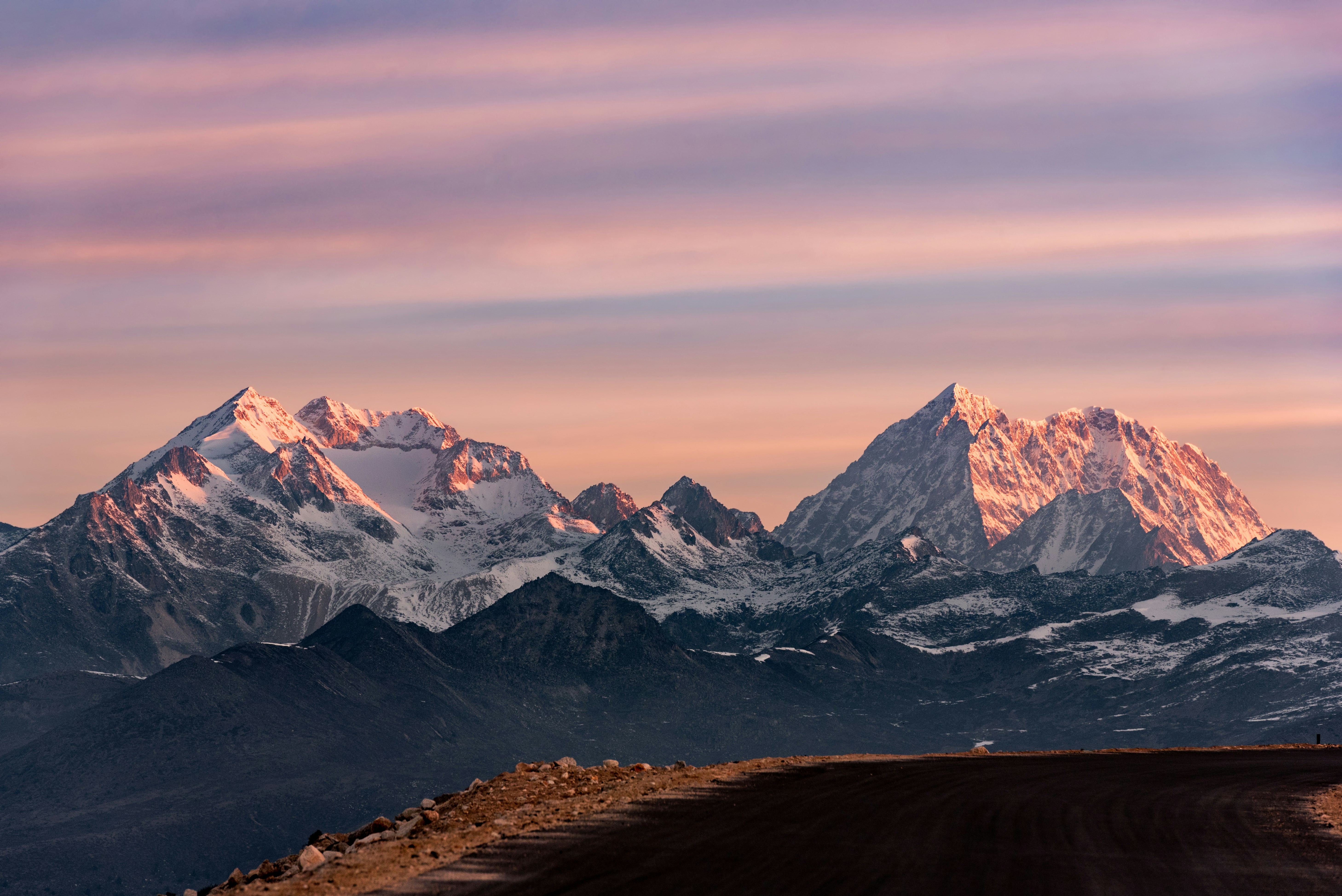 Sunlit Snow-capped Mountain Range