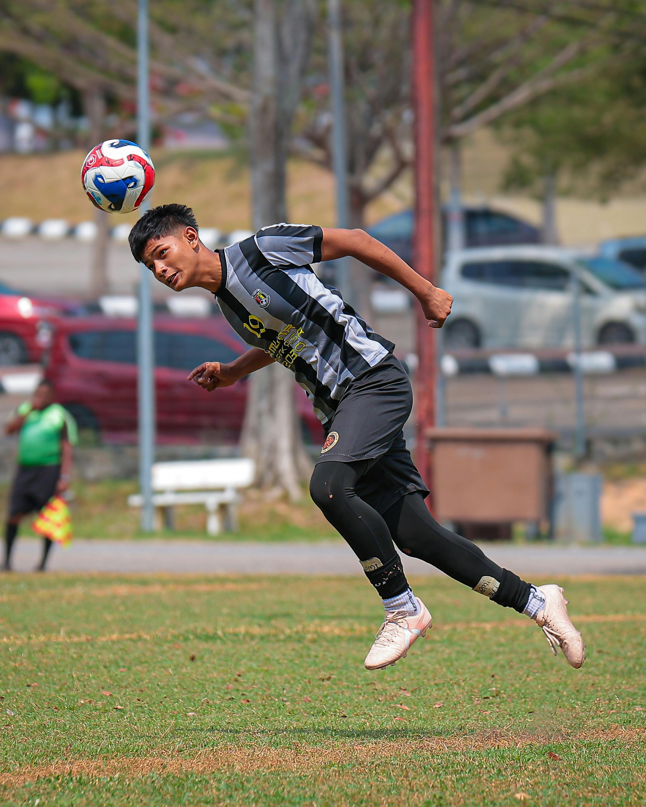 Soccer Player Heading the Ball