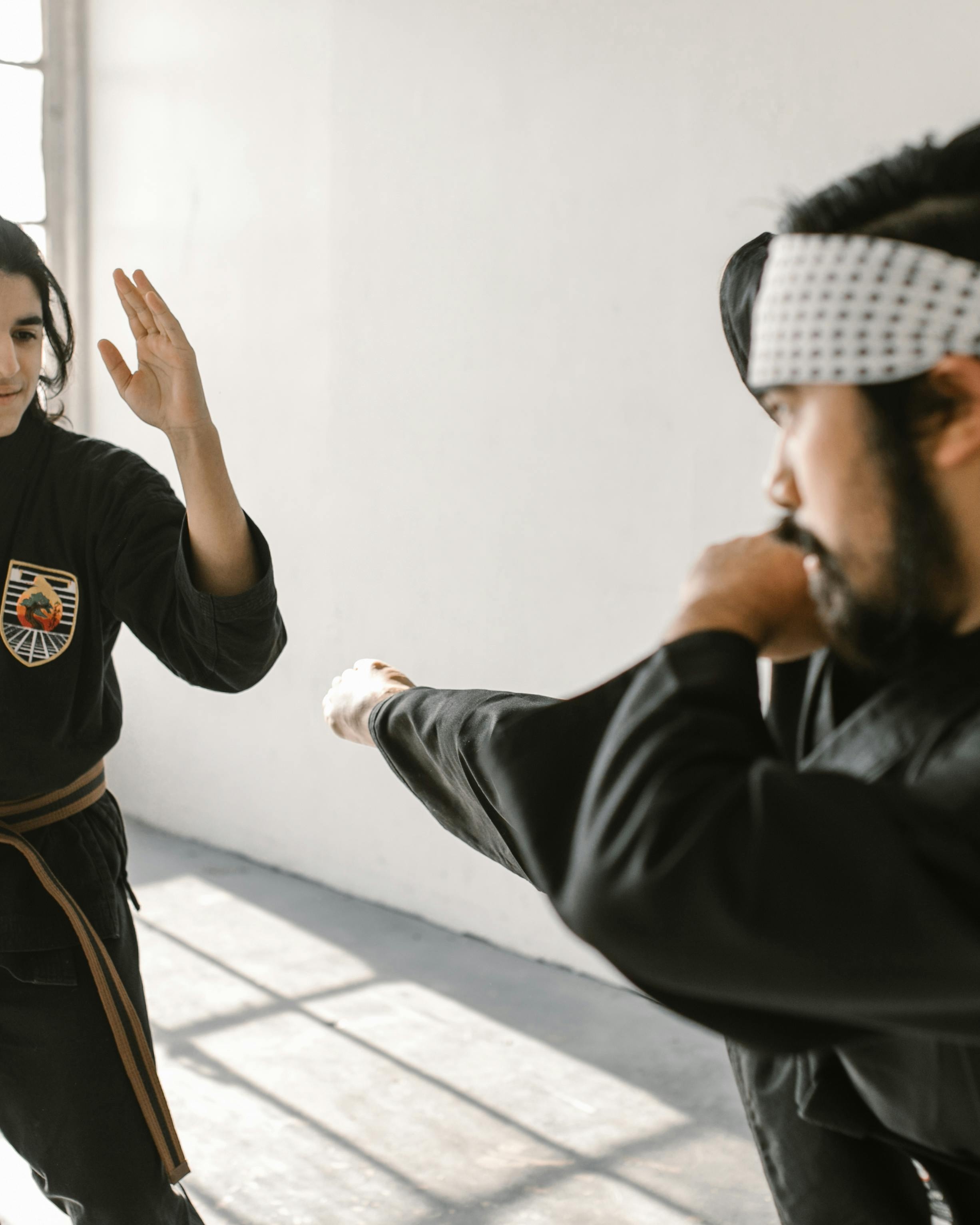 Two Martial Artists Practicing Sparring