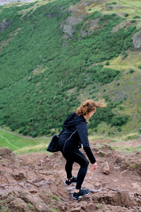 Woman Climbing Rocky Hiking Trail