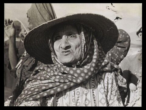 Portrait of Elderly Woman in Wide Hat