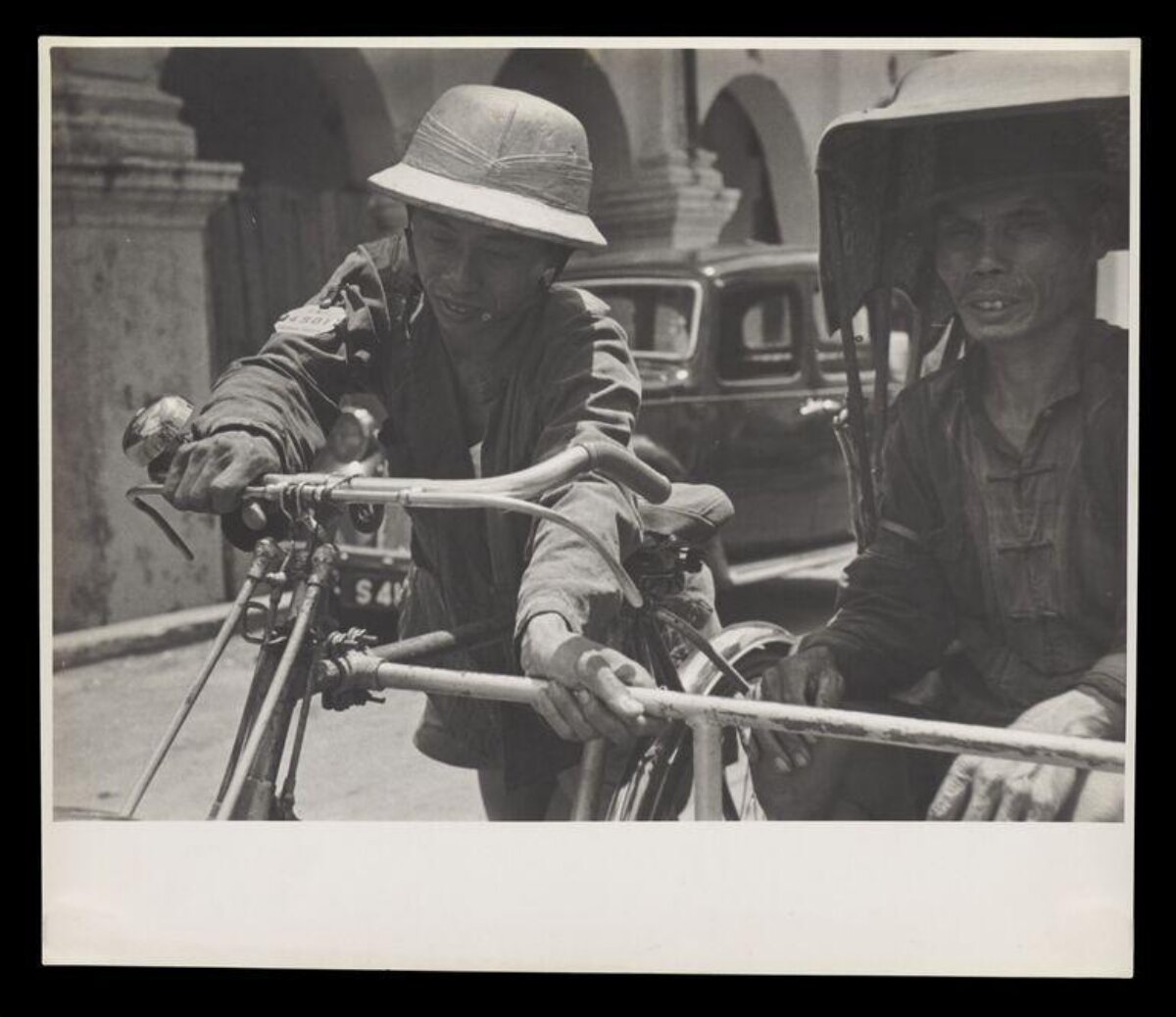 Old Photo of Two Rickshaw Pullers
