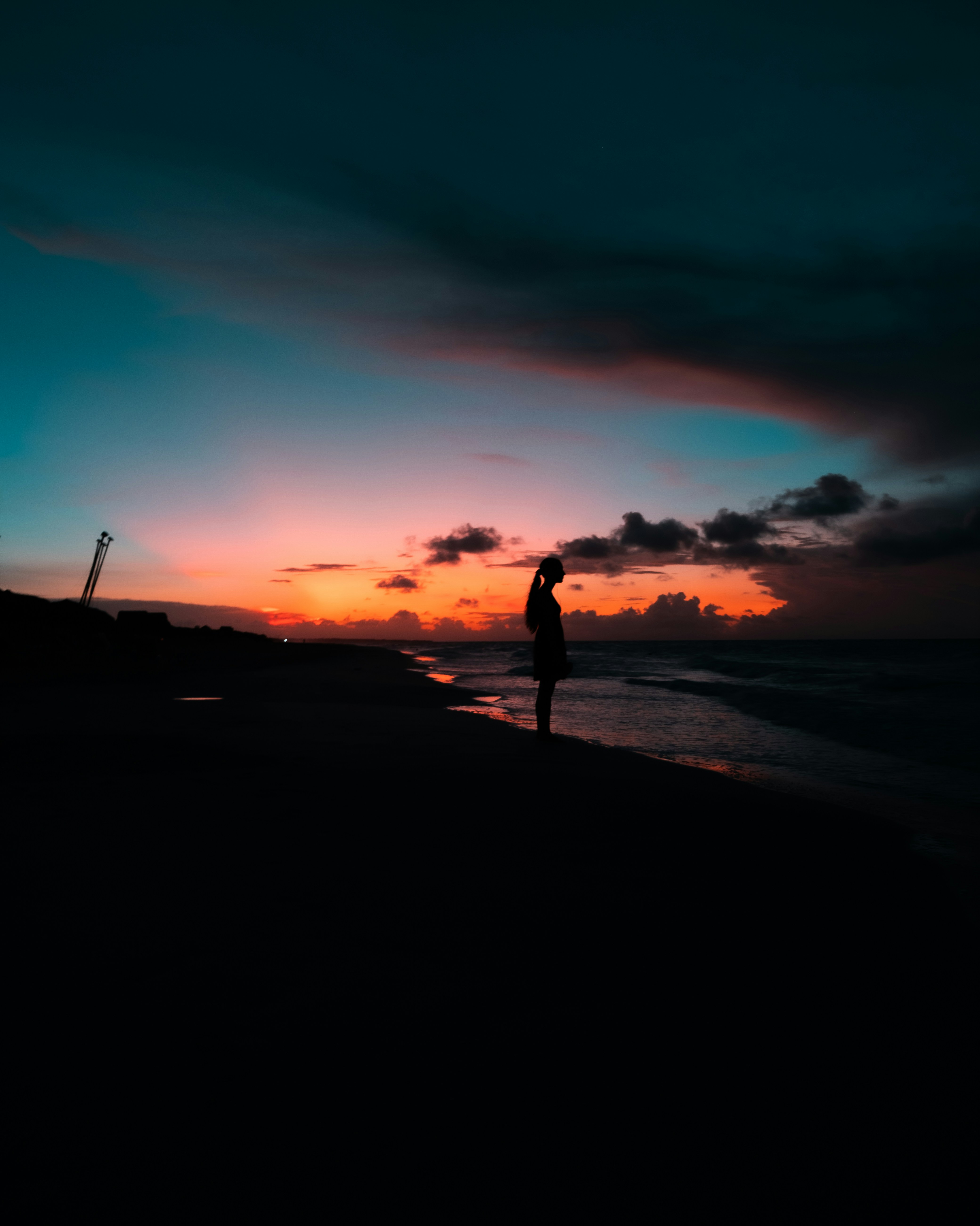 Woman Silhouette at Beach Sunset