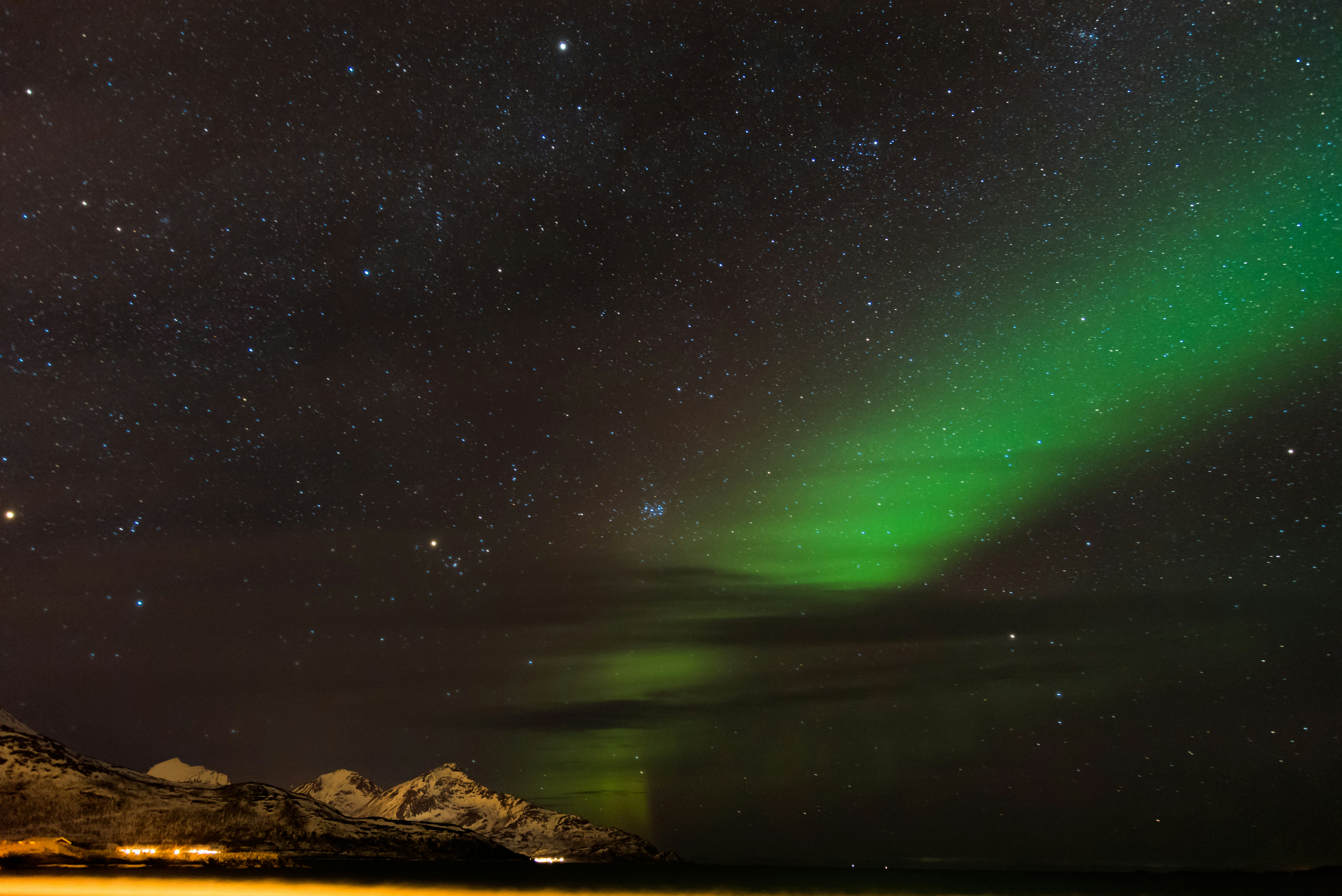 Aurora Borealis Over Snowy Mountains