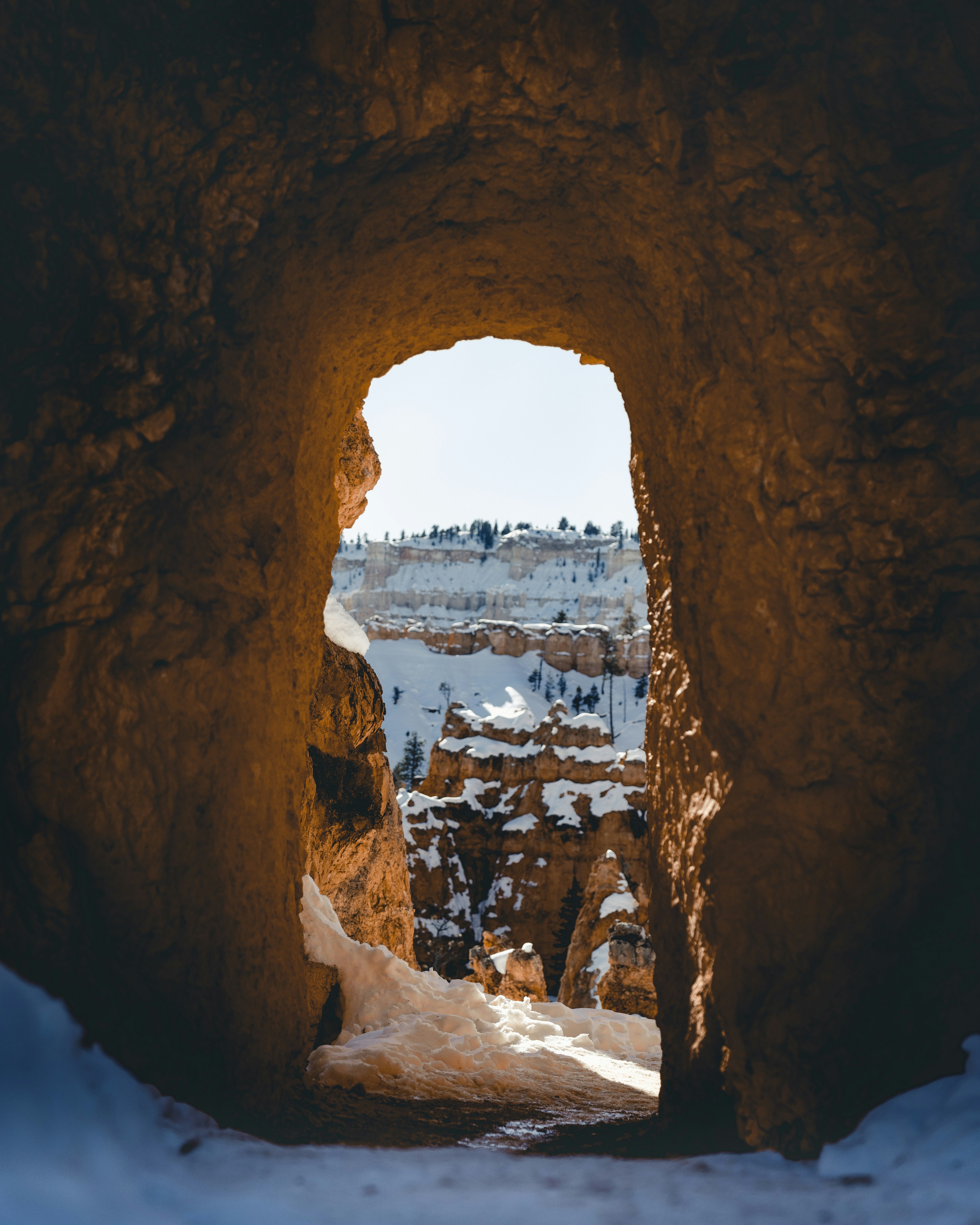 Snowy Canyon View Through Rock Tunnel