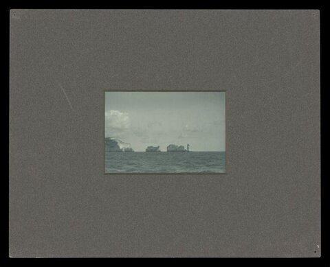 Coastal Sea Stacks and Lighthouse View