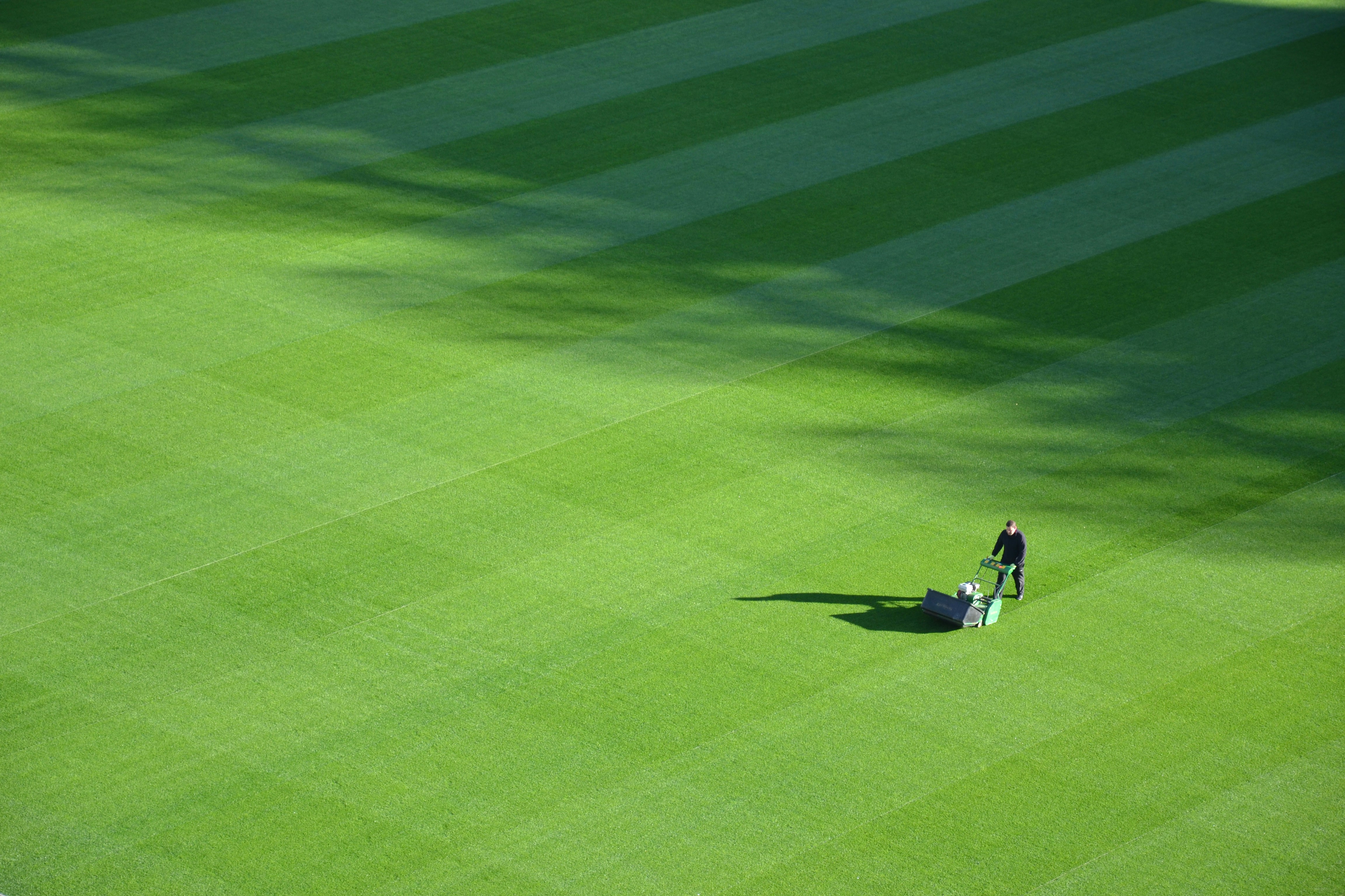 Groundskeeper Mowing Sports Field