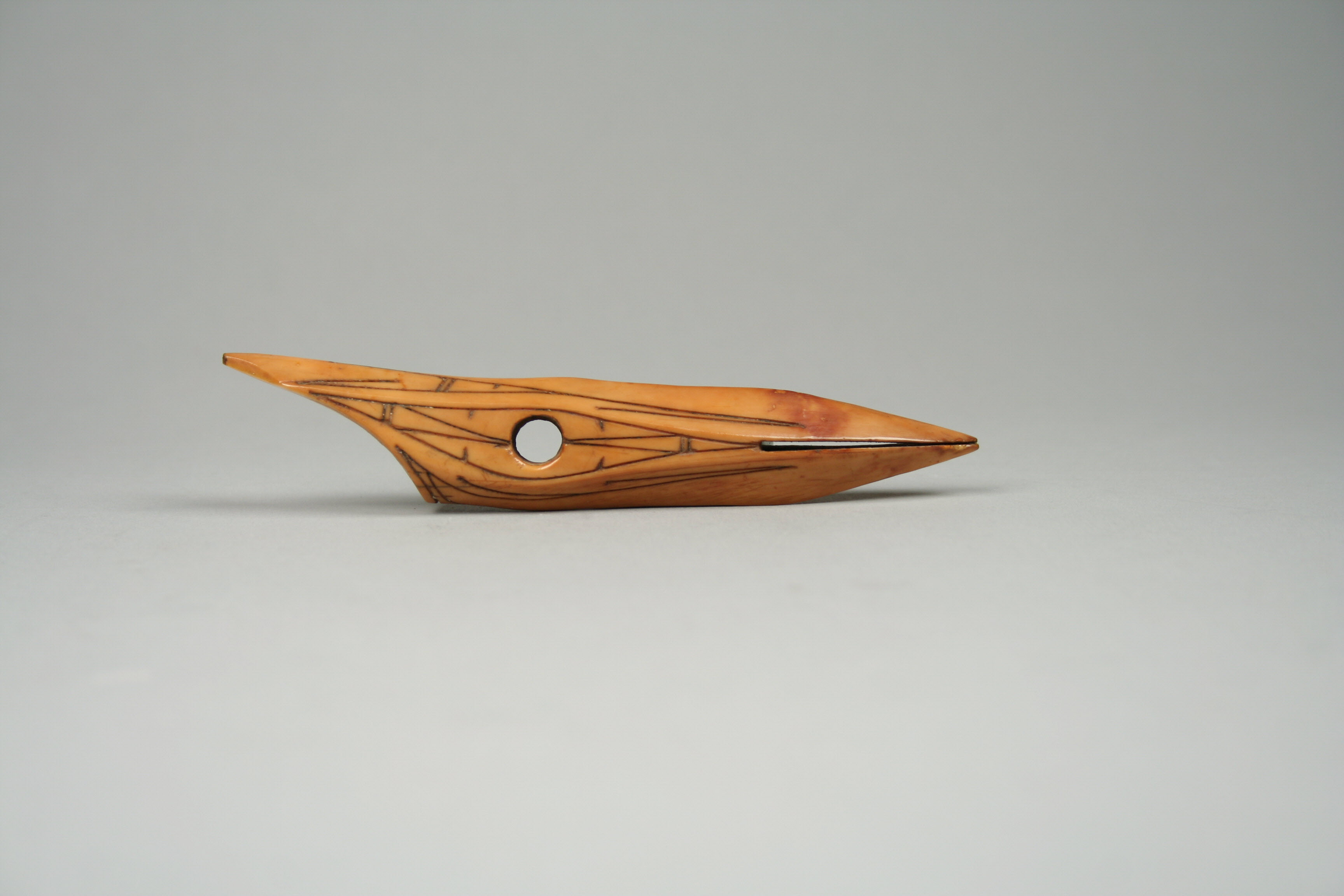 Carved Ancient Bone Shuttle