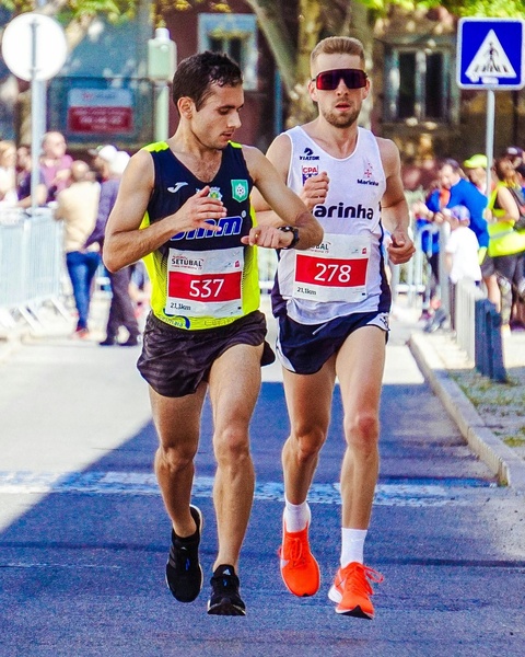 Two Runners Competing in Half Marathon
