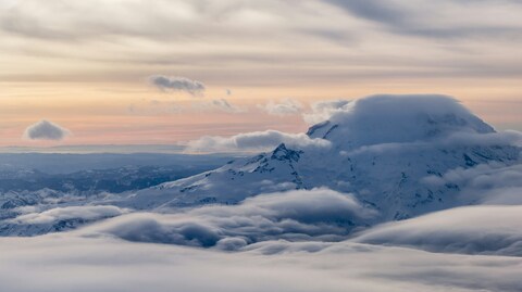 Snow-covered Mountain Above Sea of Clouds