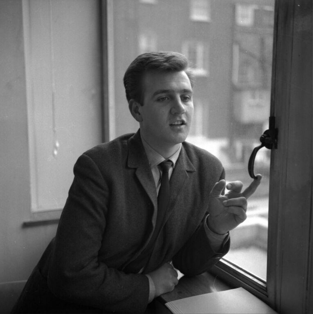 Young Man Leaning by Window