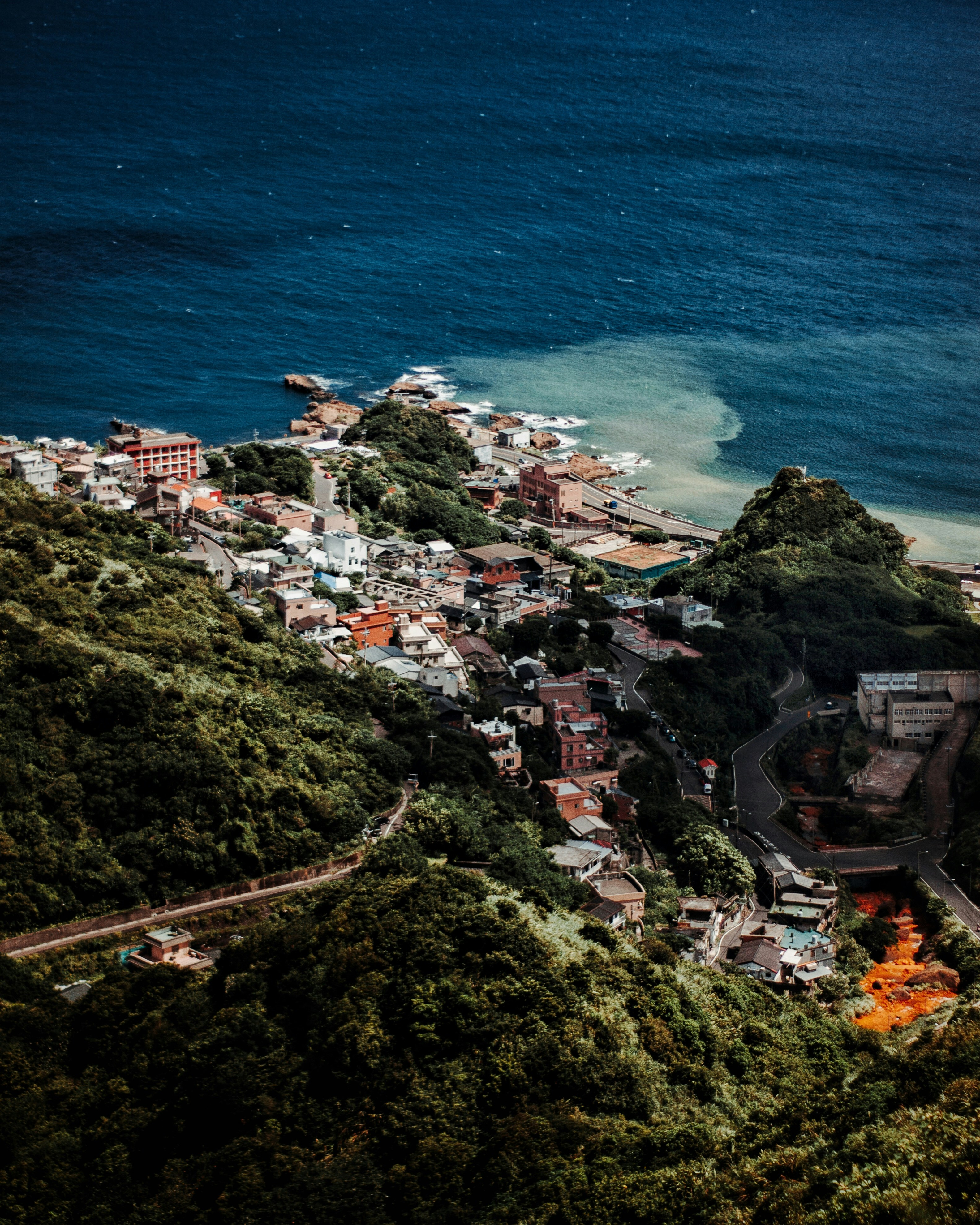 Forested Hillside Coastal Village