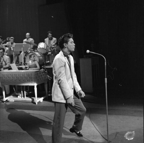 Male Singer Performing with Band