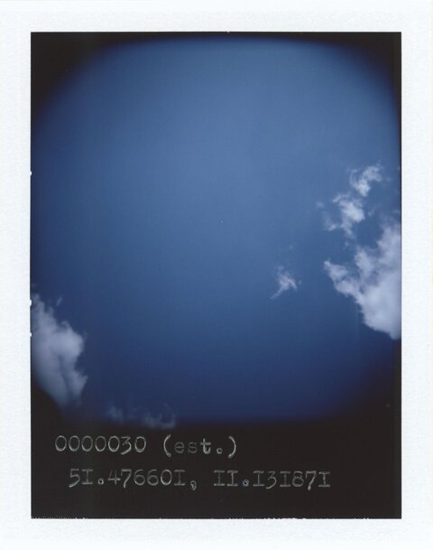 Deep Blue Sky With Scattered Clouds