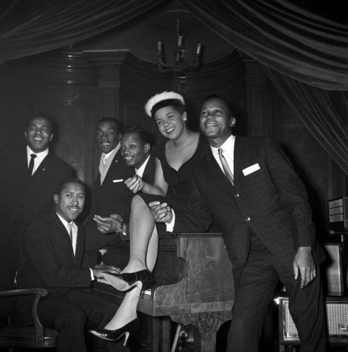 Jazz Musicians Gathered Around Piano