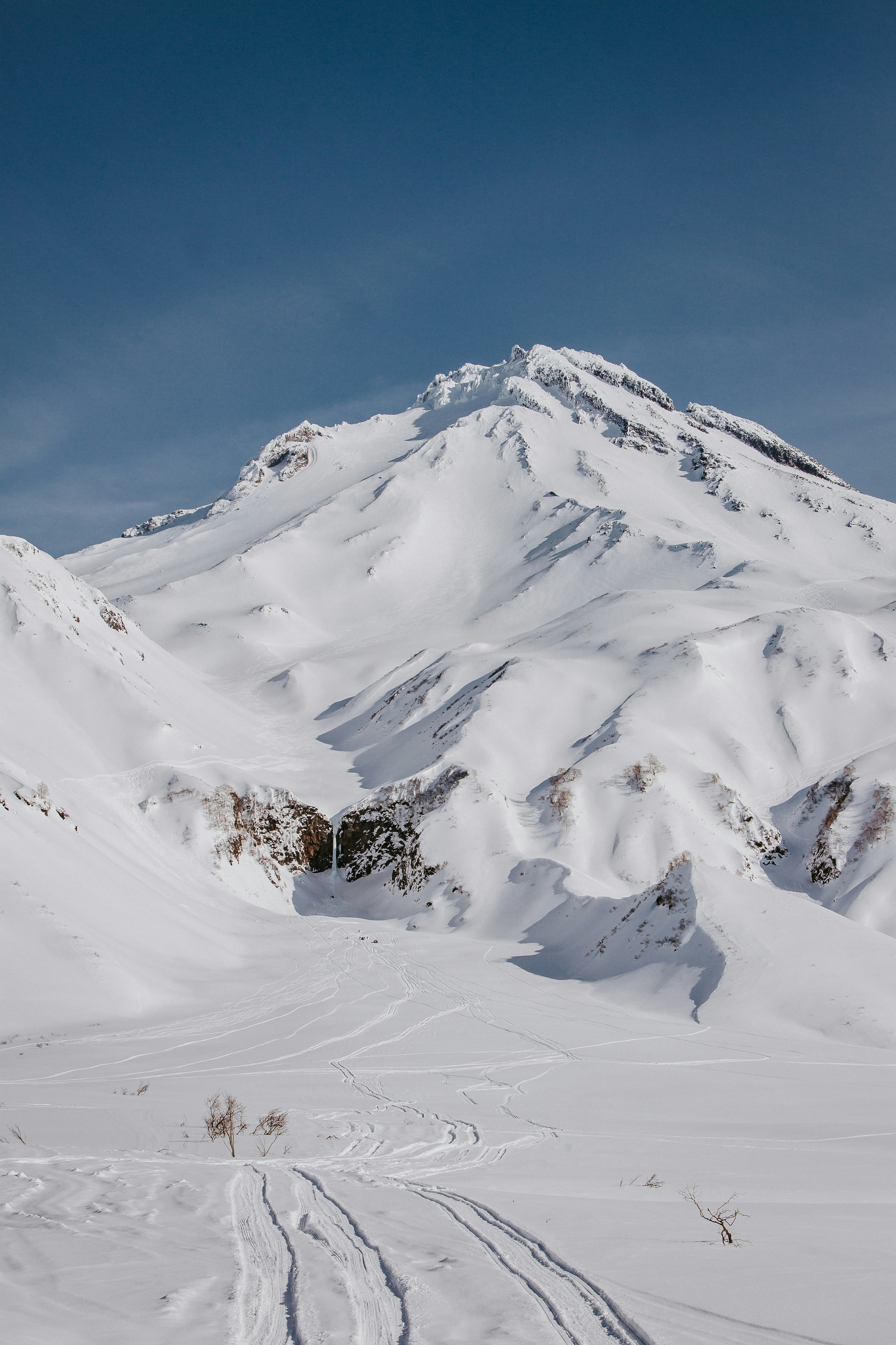 Snow-covered Mountain with Ski Tracks