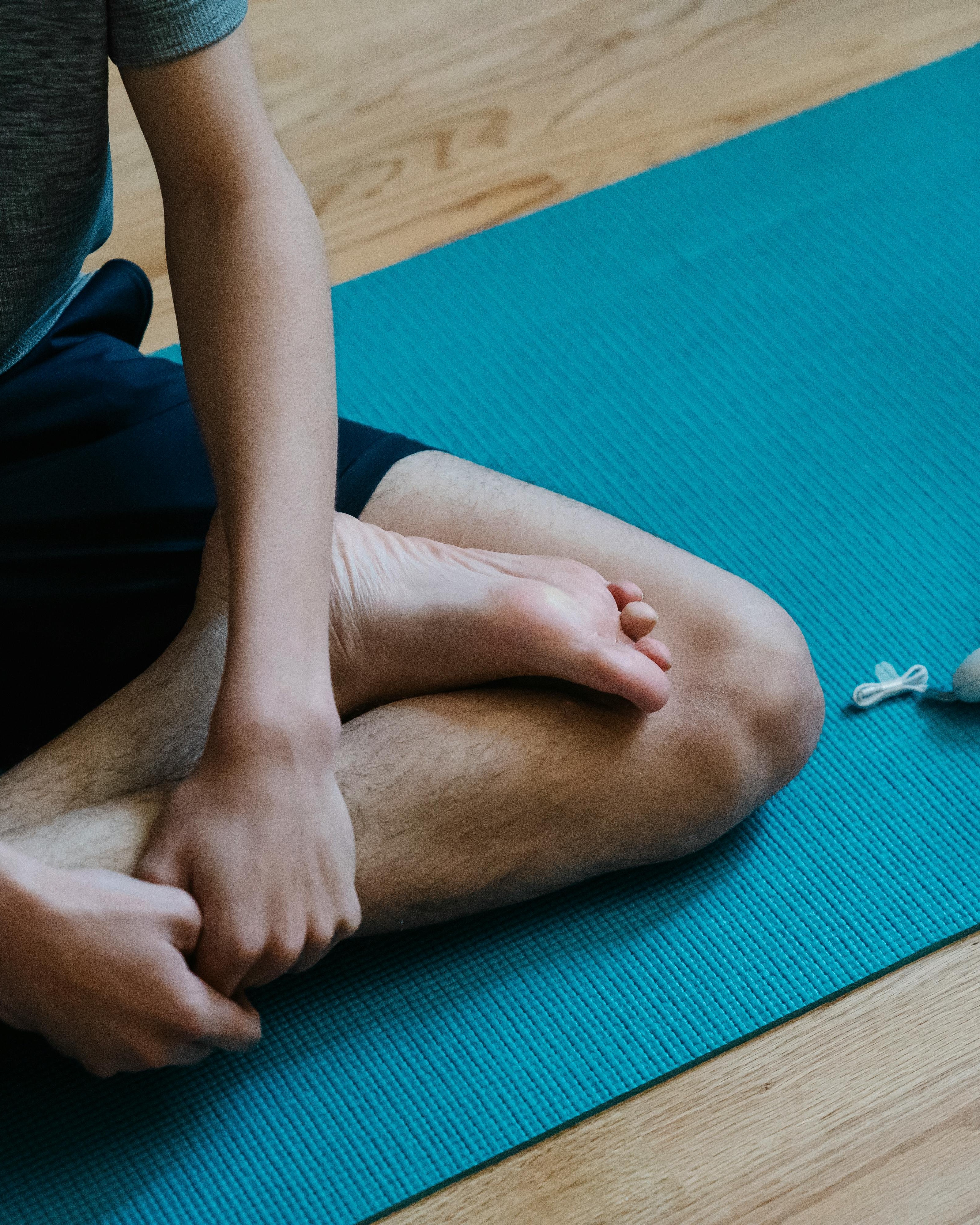 Partial Shot of Person Doing Seated Yoga