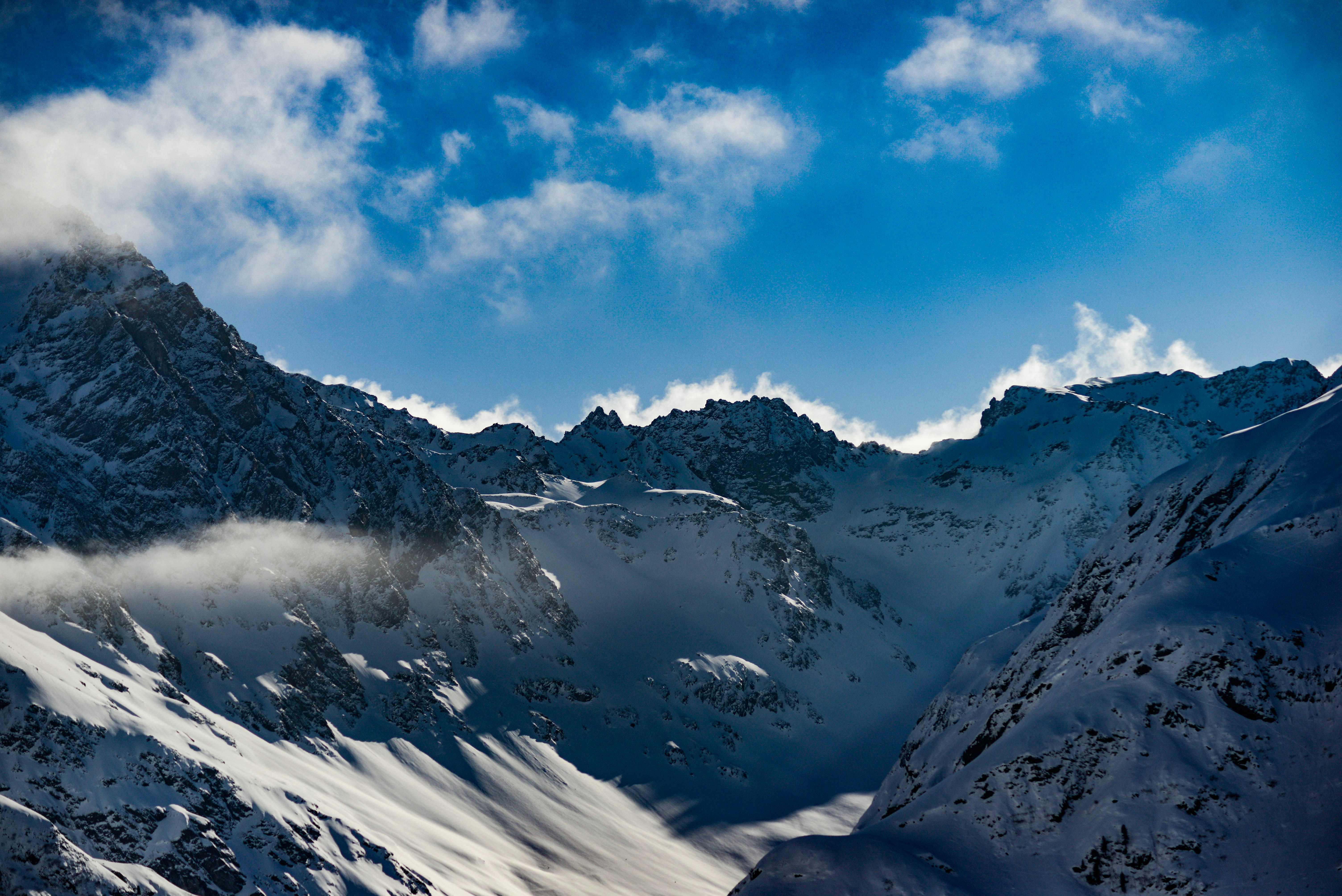 Snowy Mountain Range Under Blue Sky