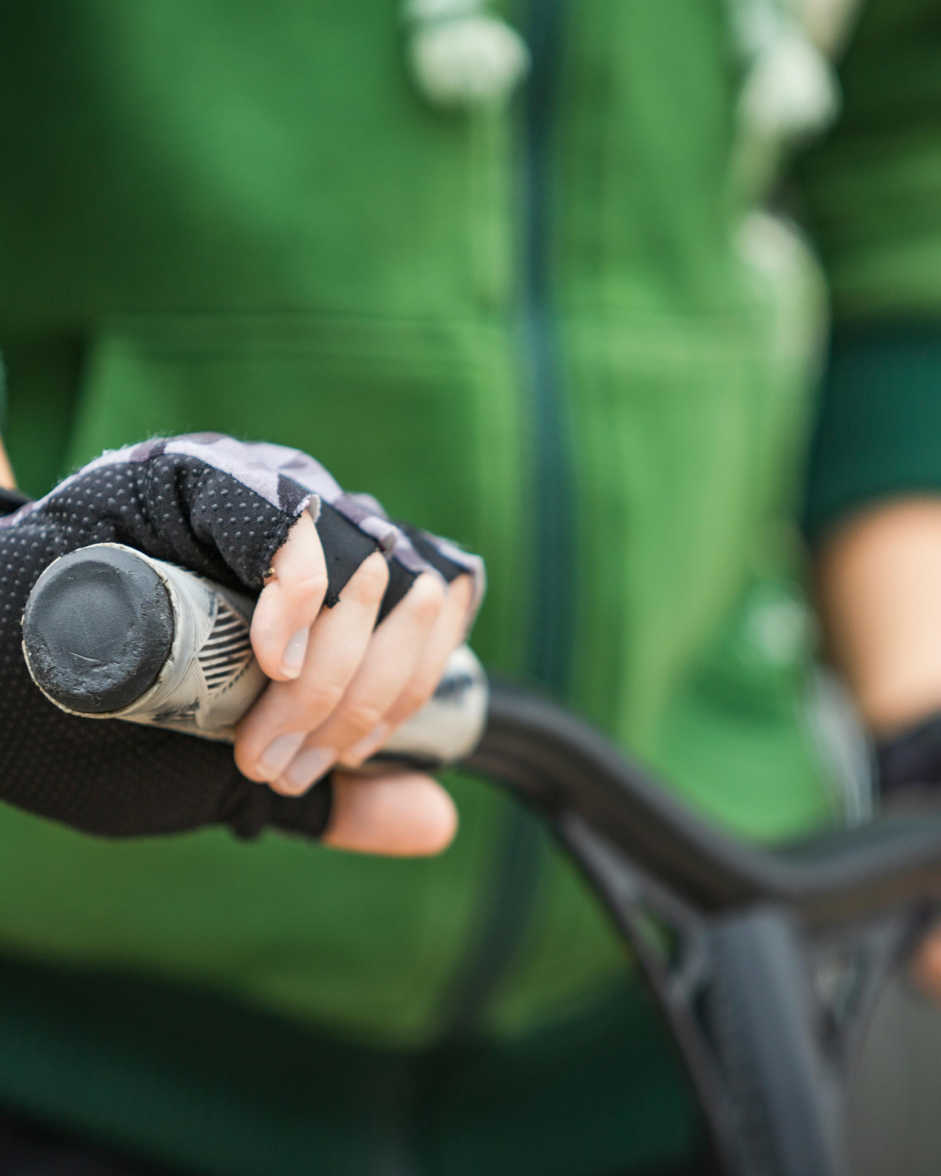Gloved Hand Holding Bicycle Handlebar