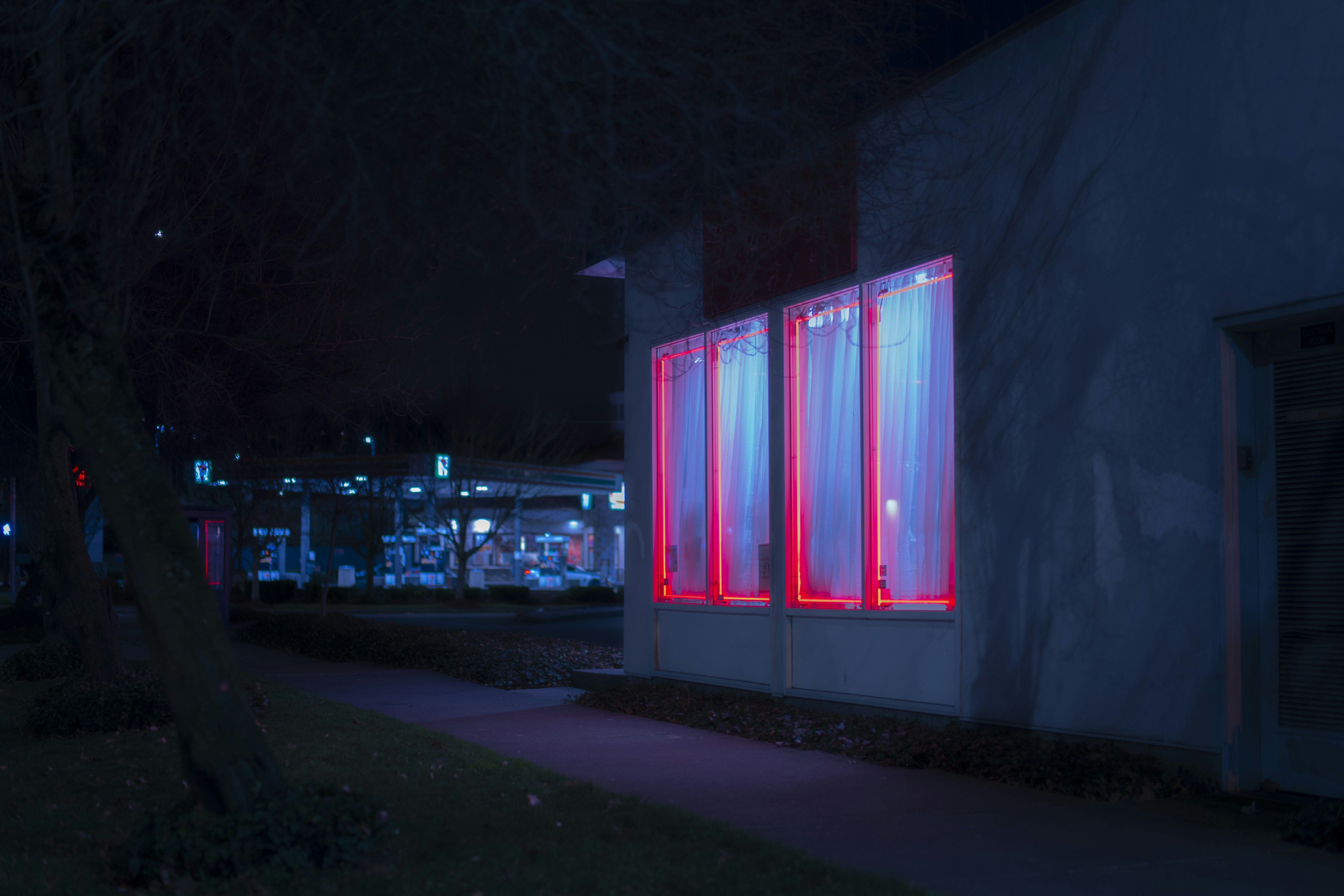 Night Storefront with Red Neon Lights