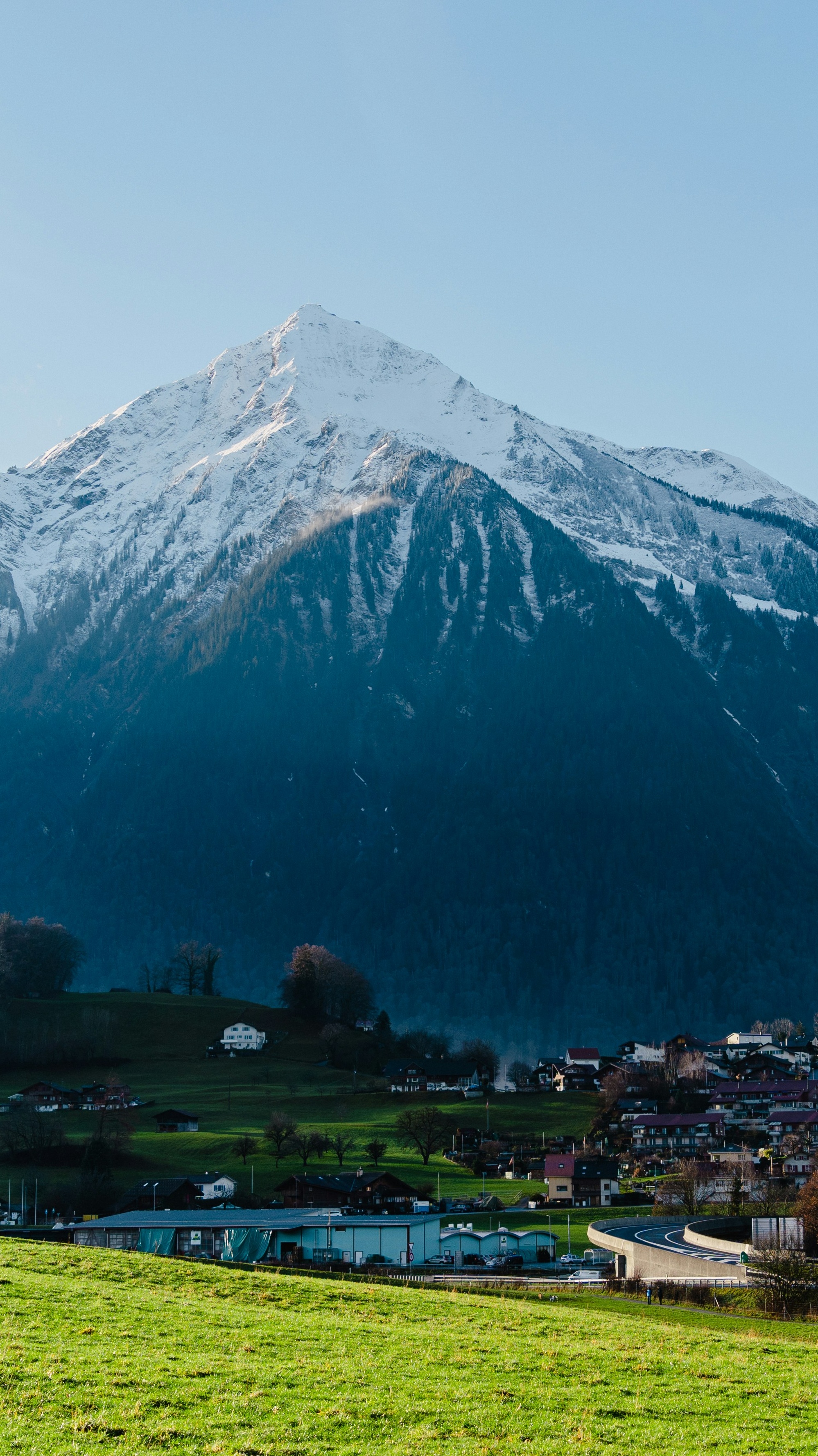 Alpine Village Beneath Snowy Mountain