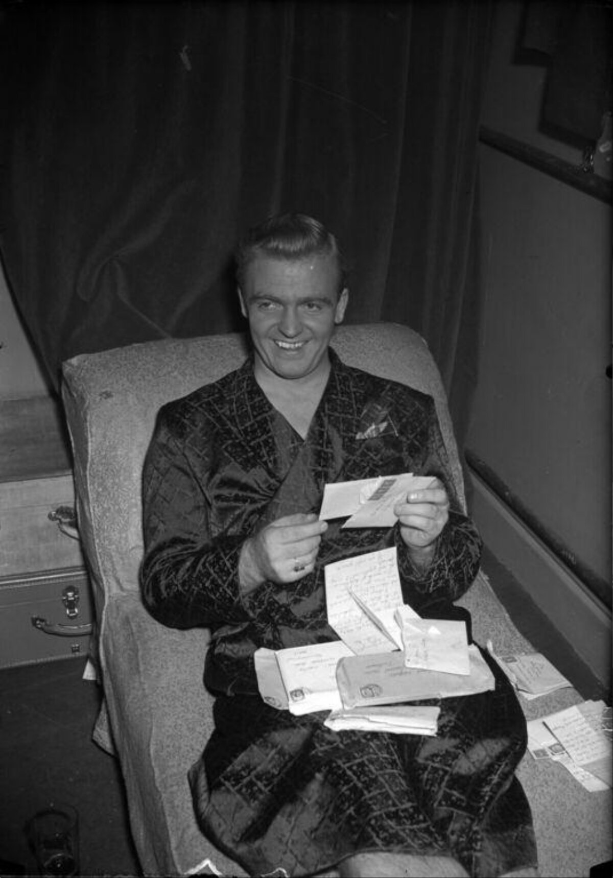Smiling Man Reading Fan Mail