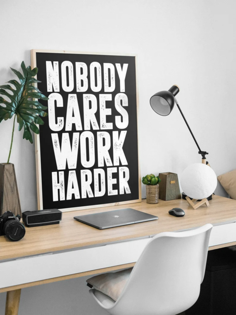 Motivational Poster on Modern Office Desk
