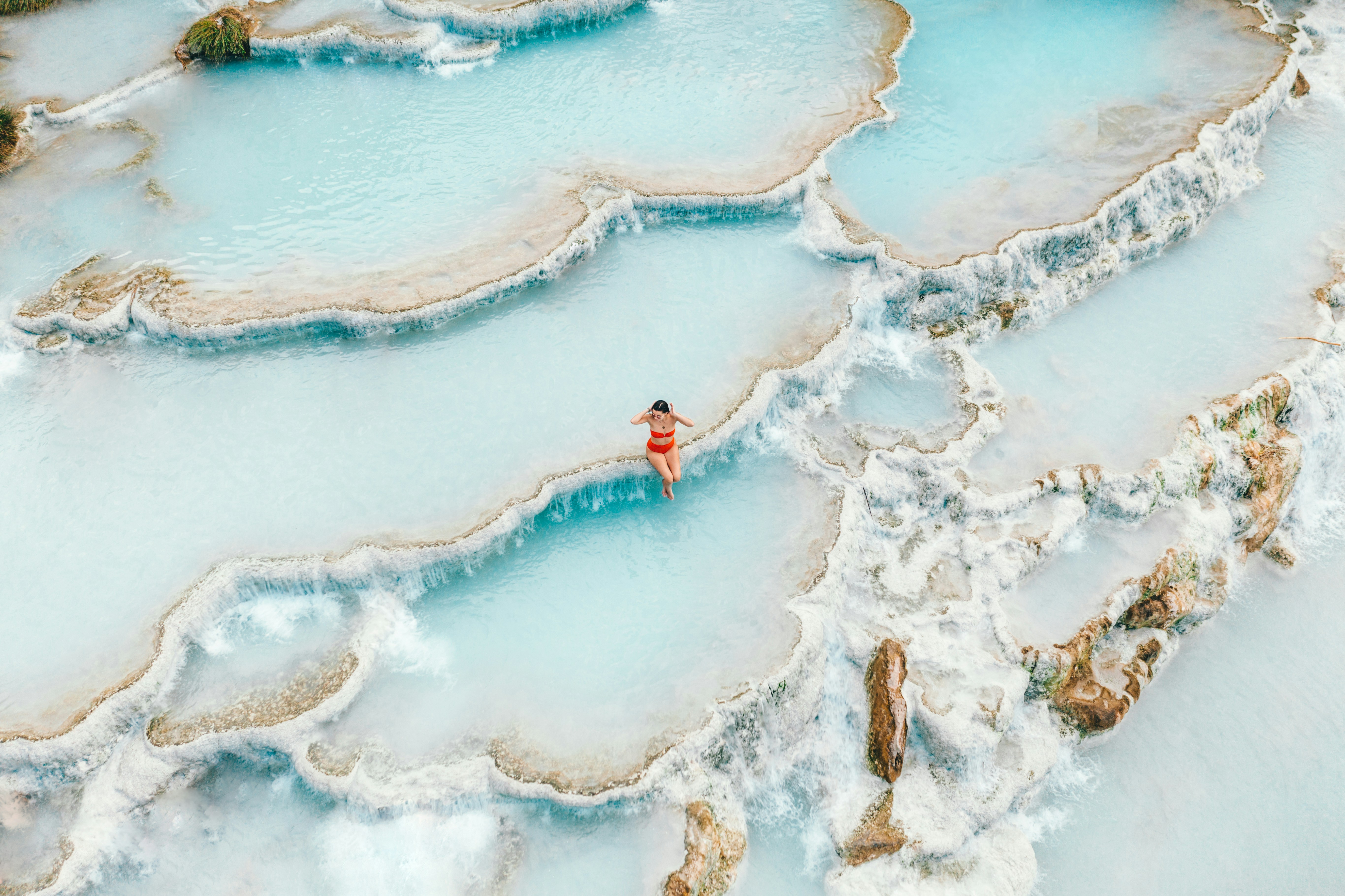 Woman Bathing in Terraced Hot Springs