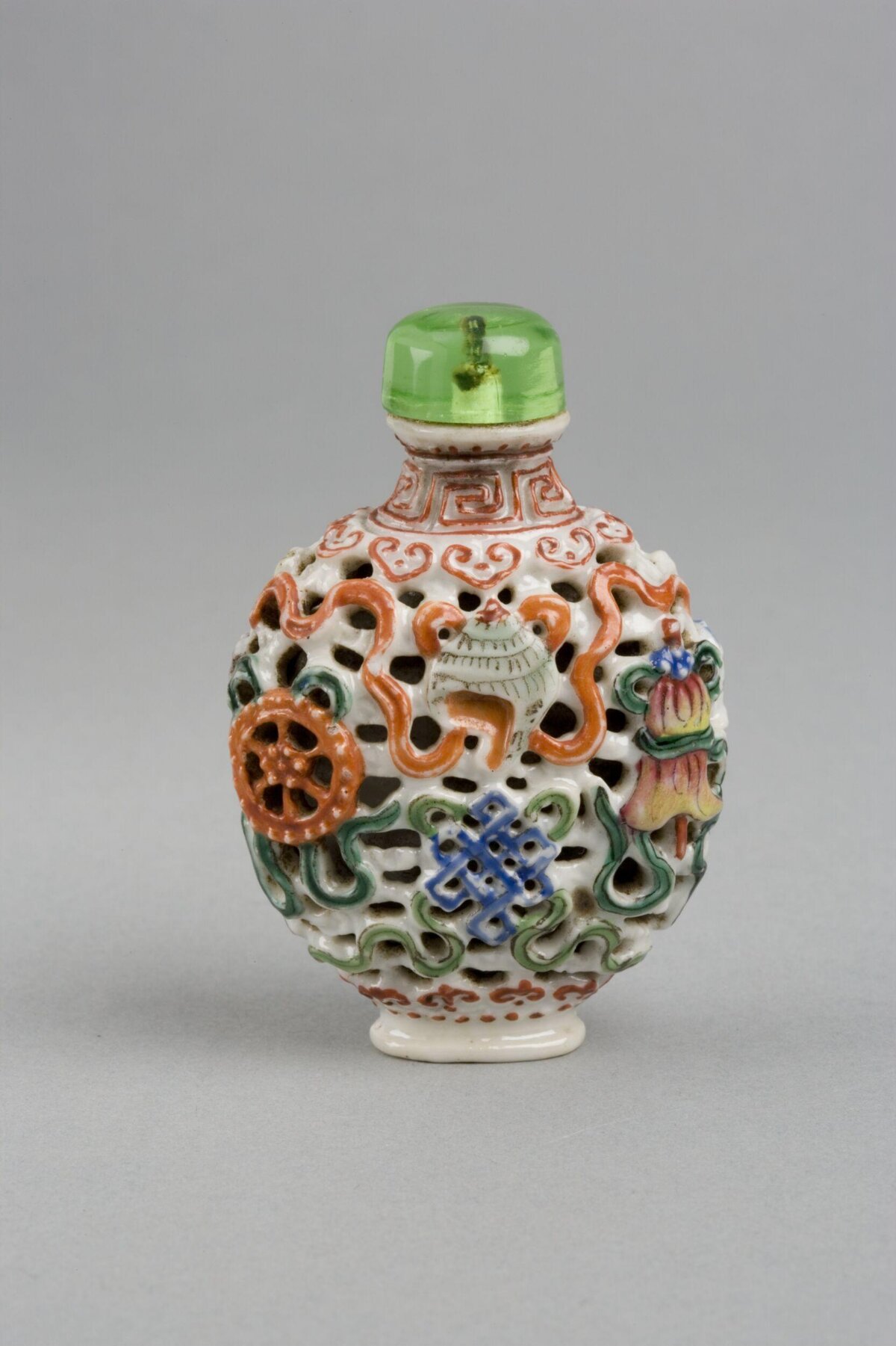 Openwork colored porcelain snuff bottle