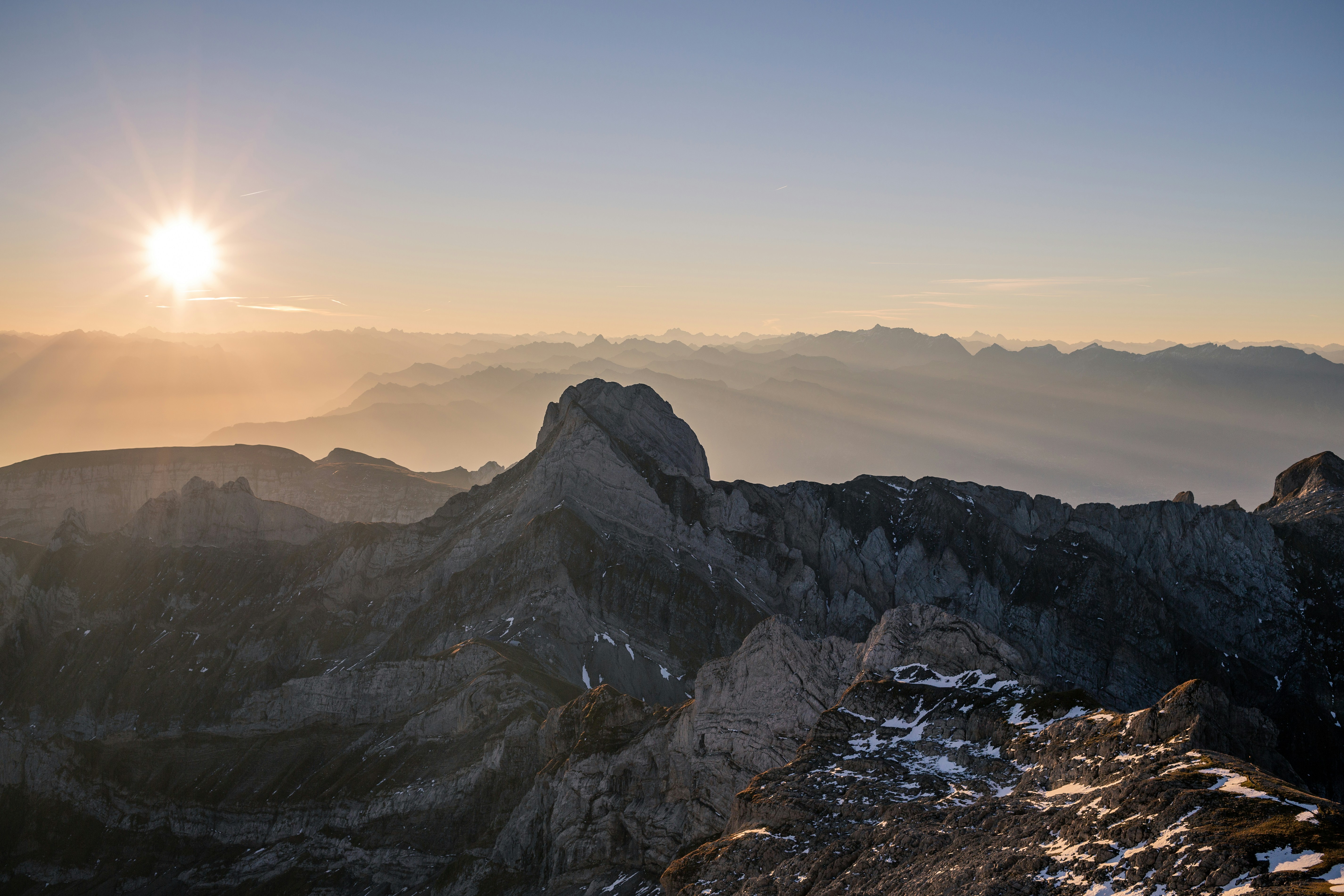 Sunrise Over Layered Mountain Ranges