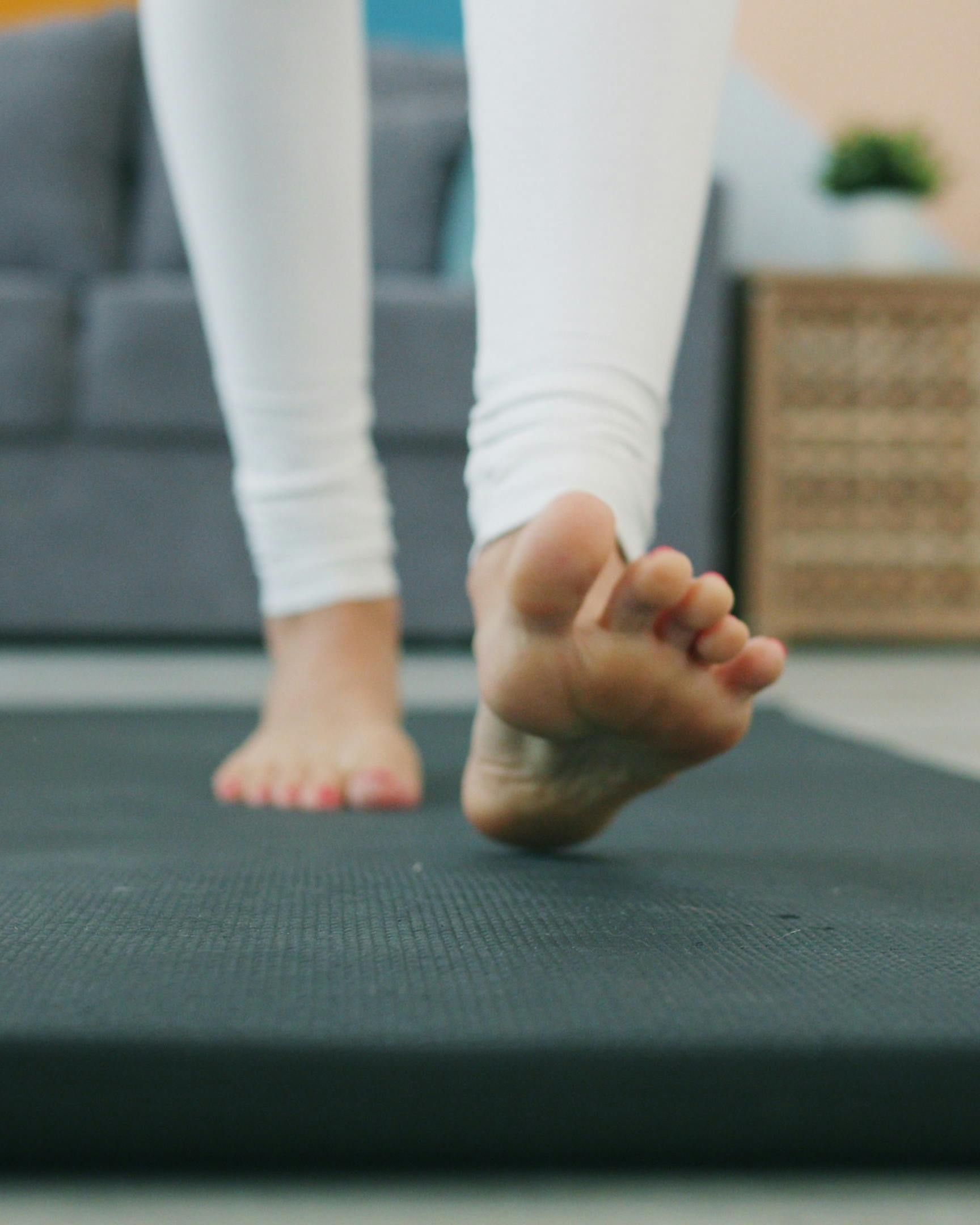 Bare Feet on a Yoga Mat