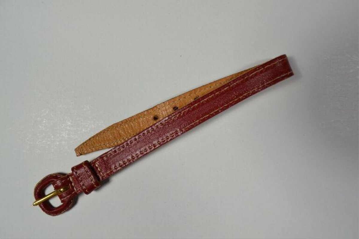 Red Leather Belt on Gray Background