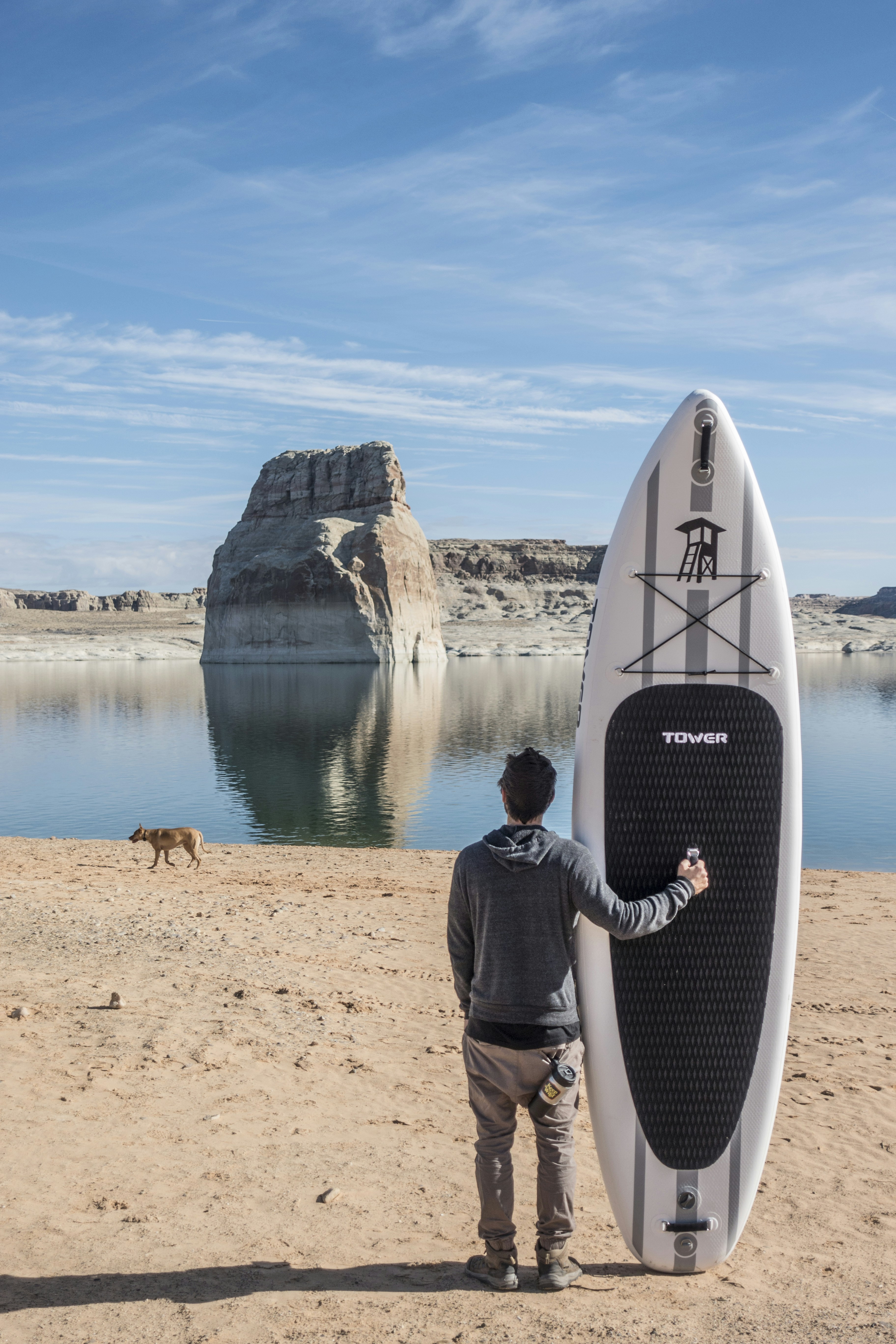 Man with Paddle Board at Lake Shore
