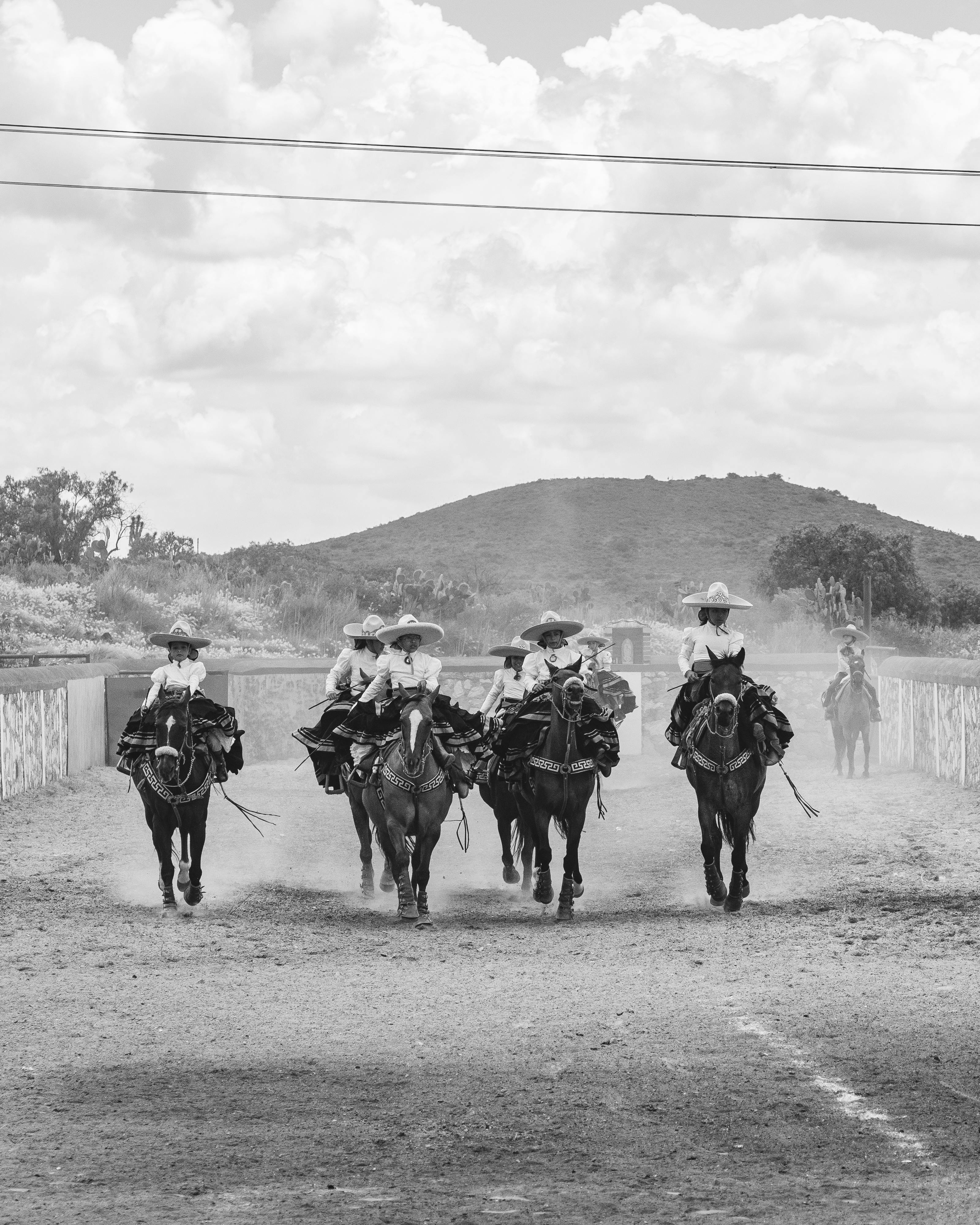 Mexican Charros Riding in Arena