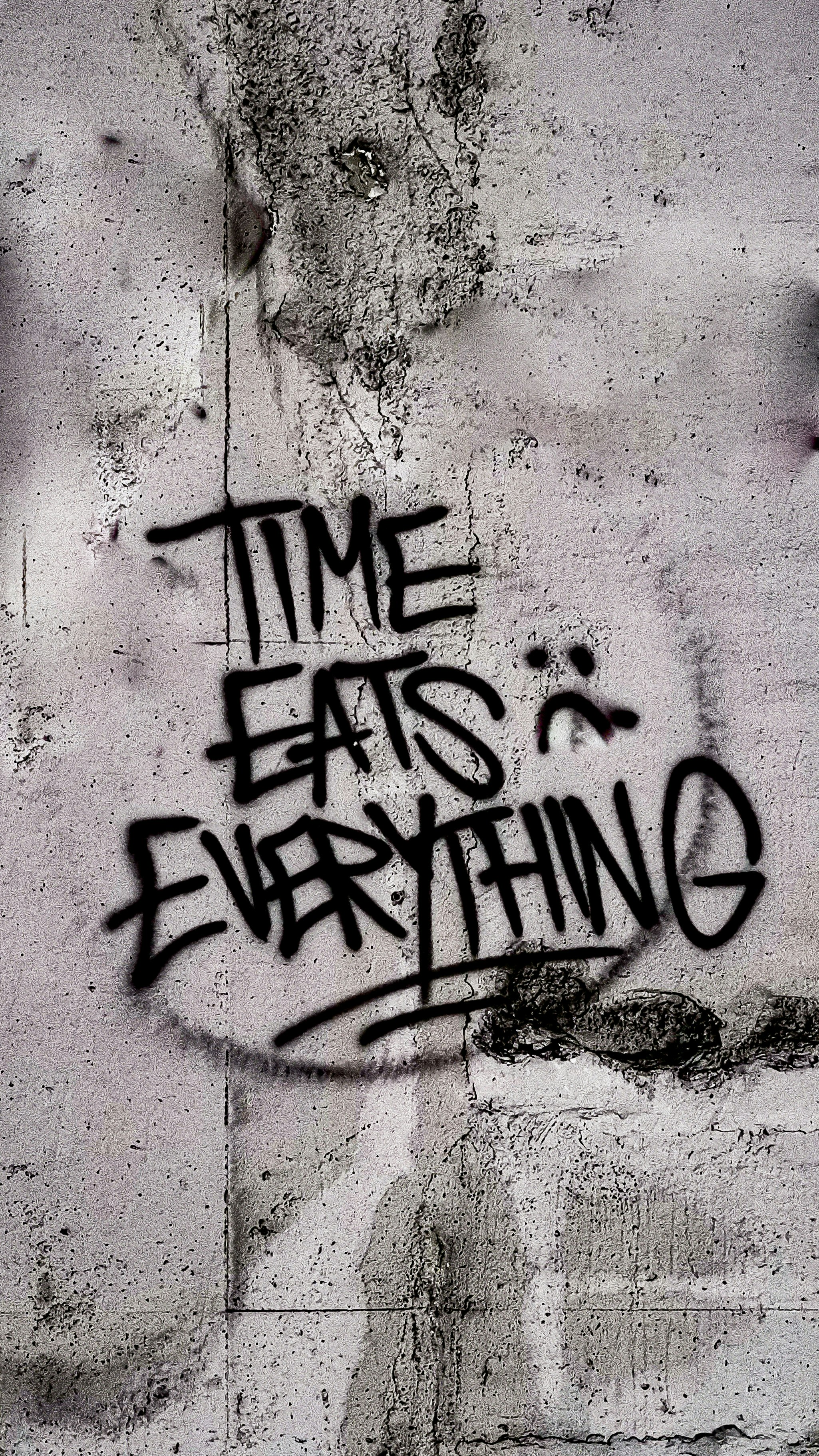 Time Eats Everything Graffiti on Concrete Wall