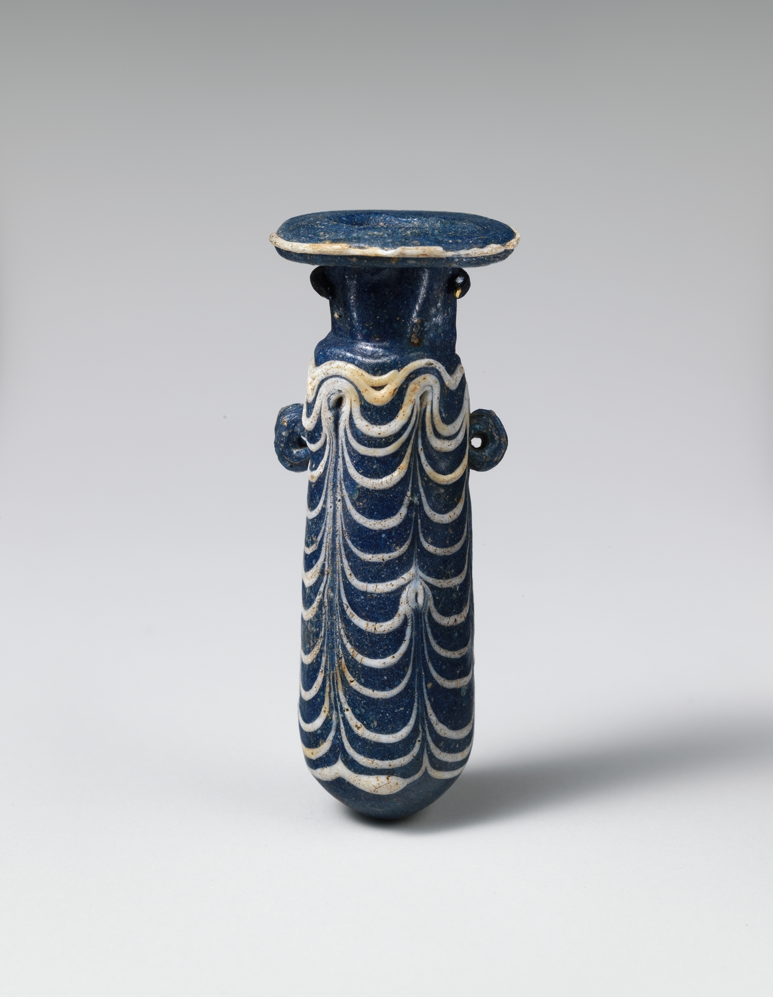 Ancient Blue Patterned Glass Bottle