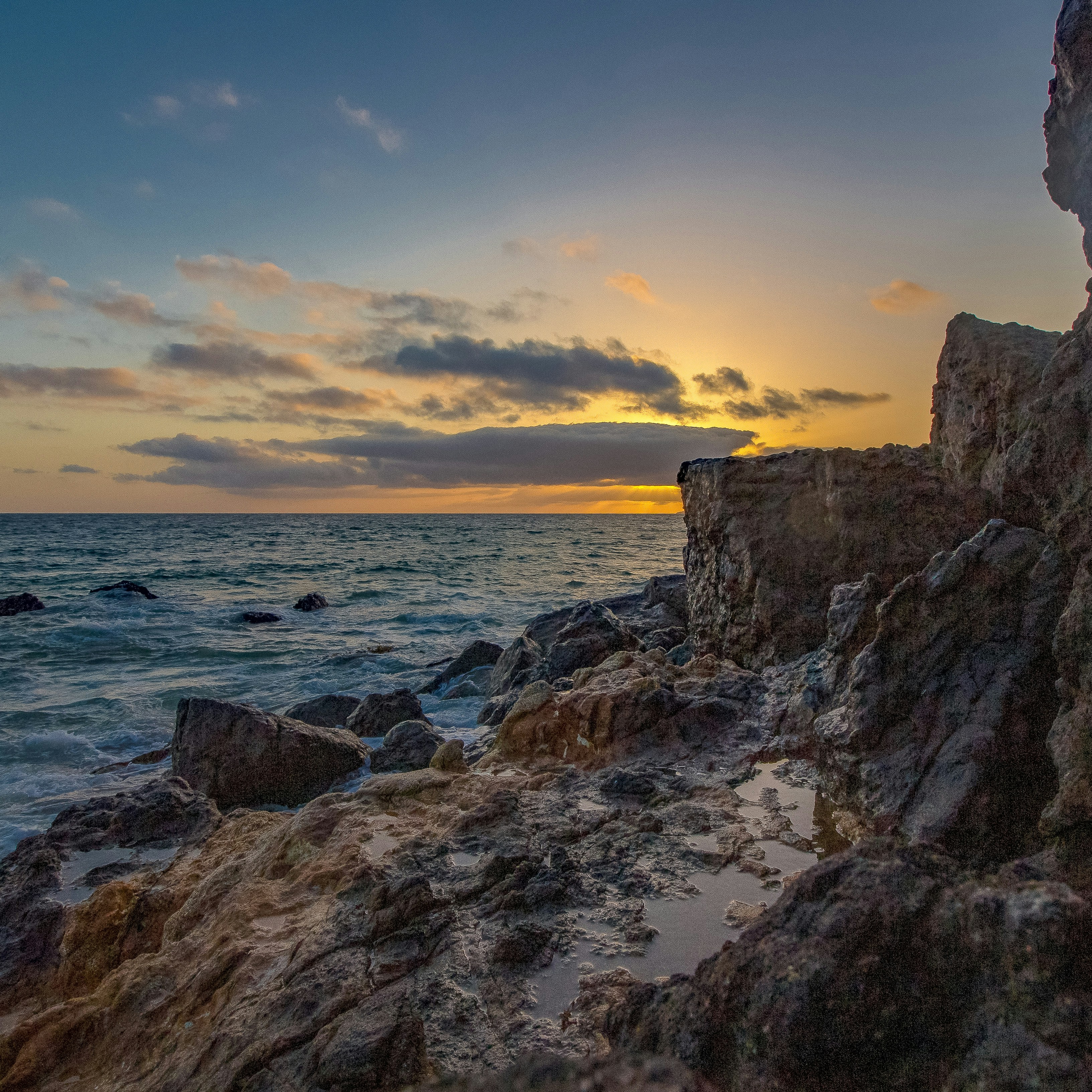 Rocky Seashore at Sunset