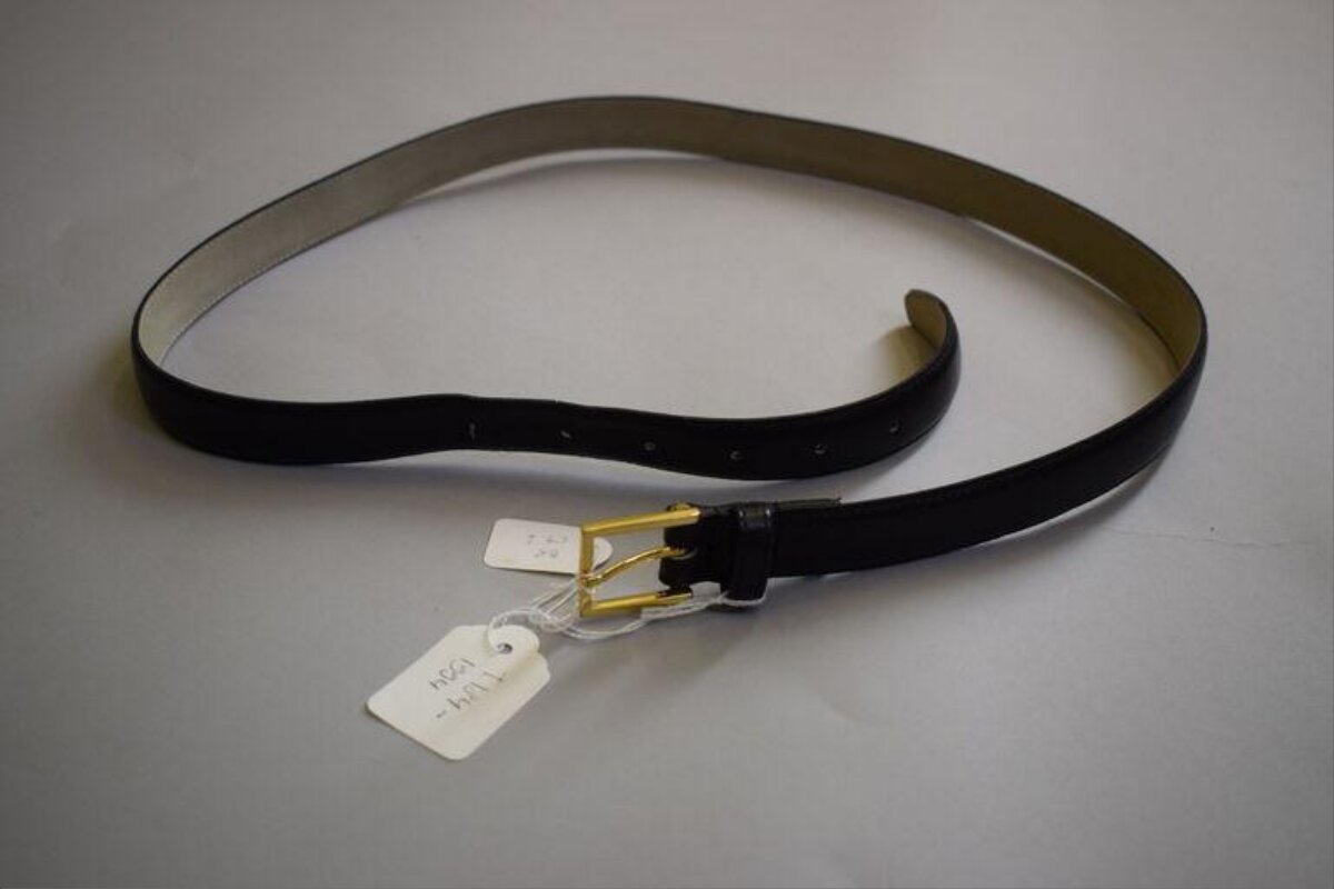 Black Leather Belt with Price Tag