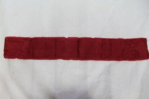 Folded Red Textile Strip
