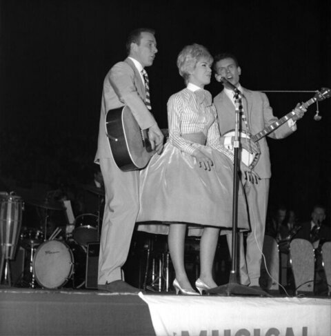 Vocal Trio Performing on Stage