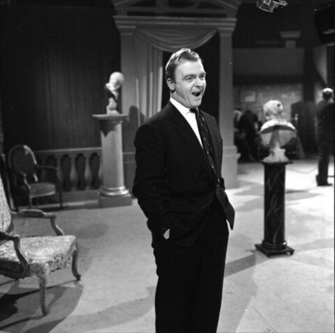 Man in Suit on Studio Stage Set