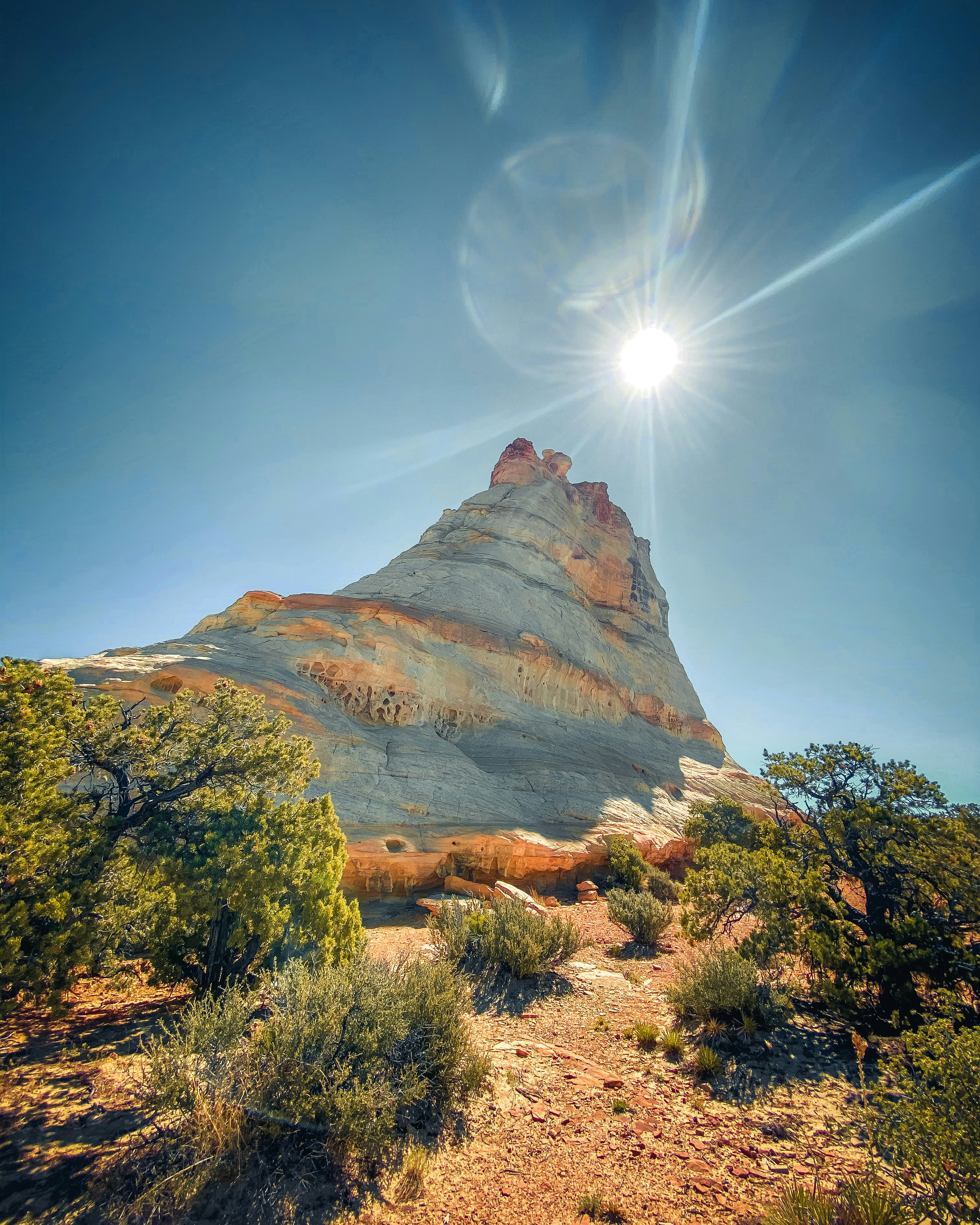 Sunlit Desert Layered Rock Peak