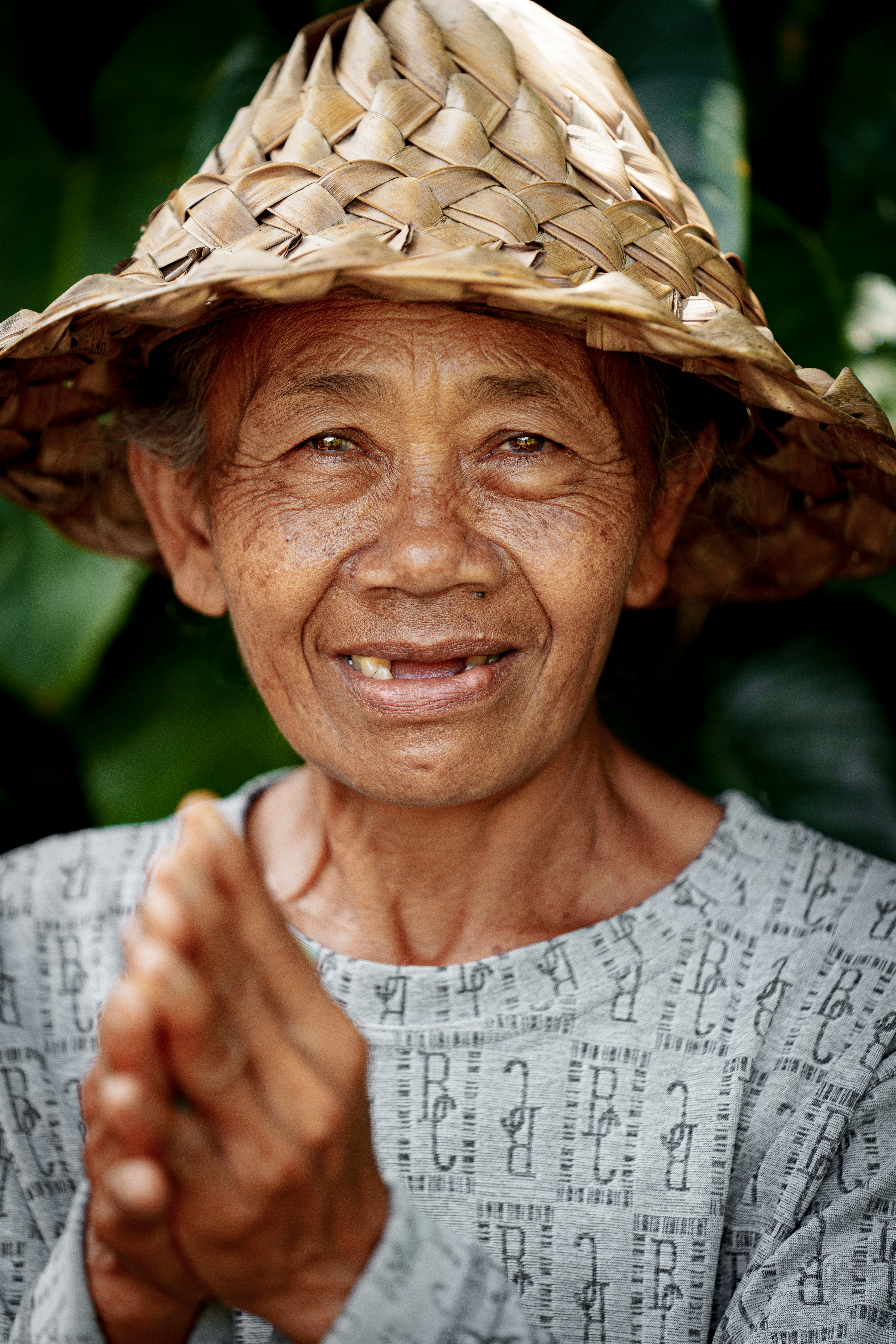 Smiling Elderly Woman with Straw Hat