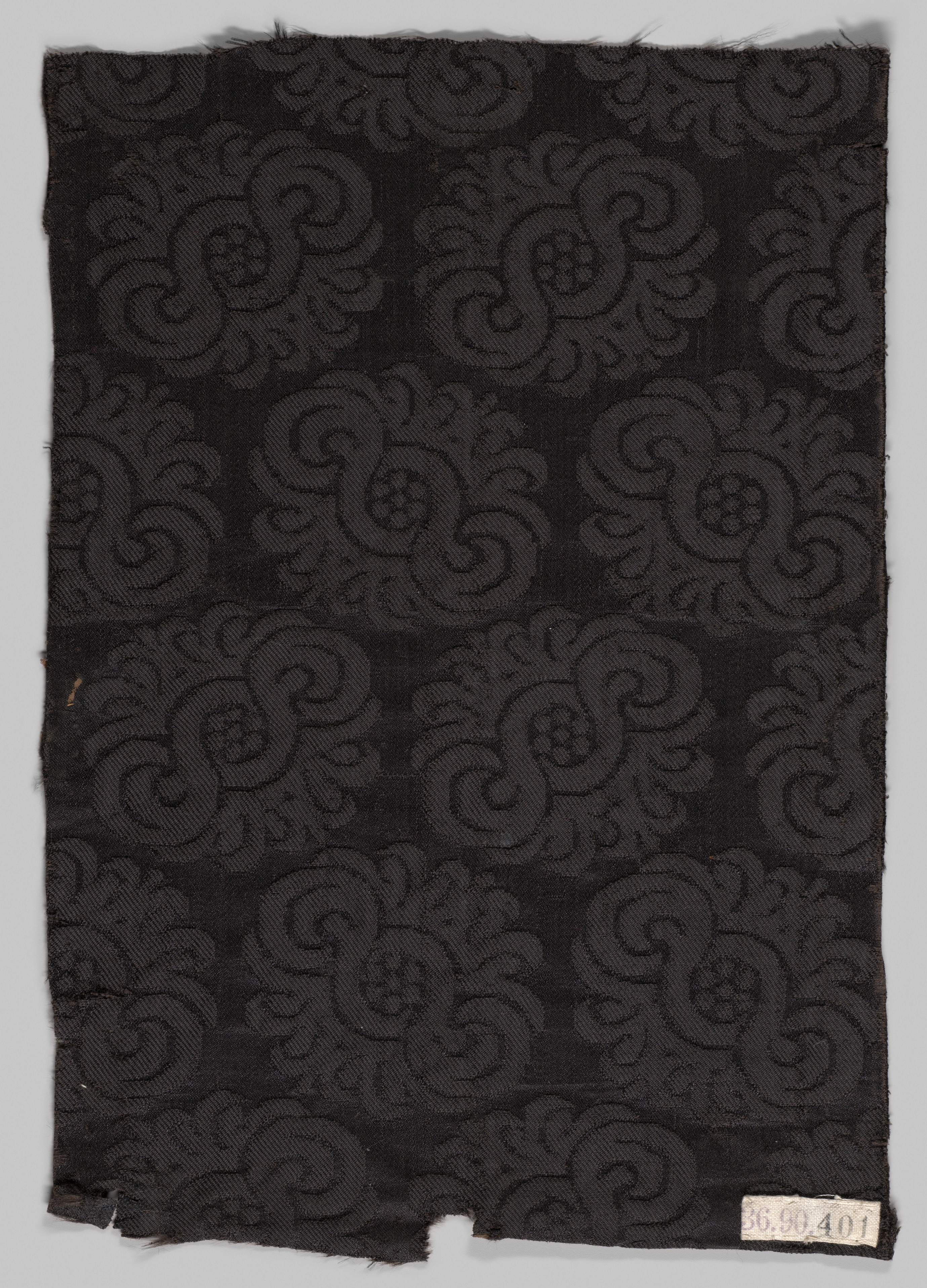 Black Spiral Pattern Woven Textile Fragment