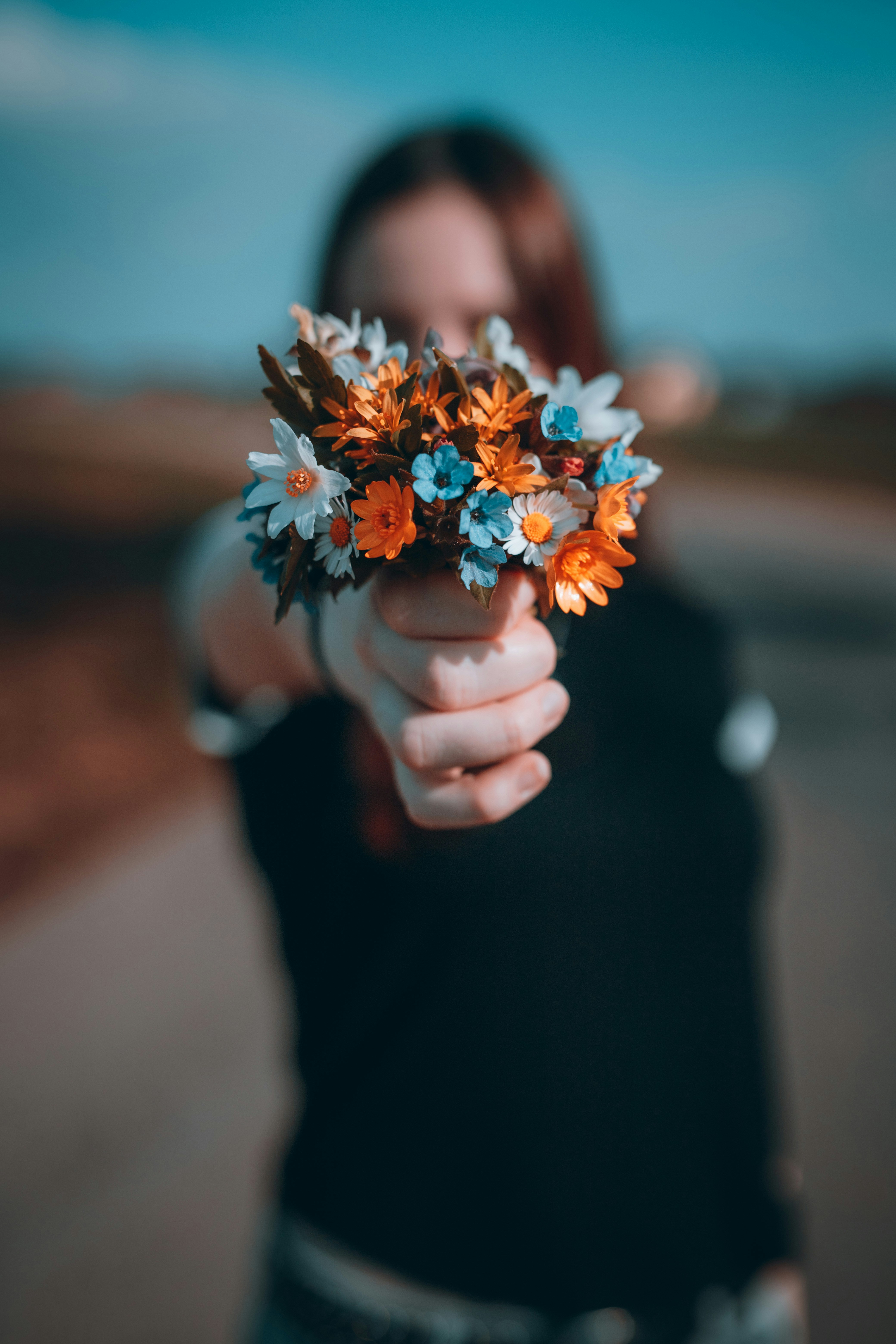 Hand Holding Wildflower Bouquet