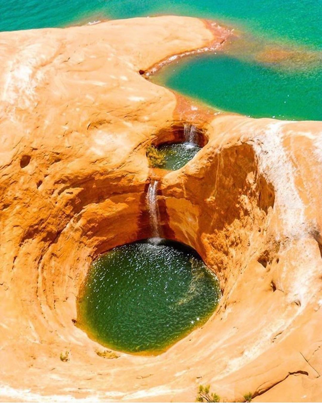 Cascading Rock Pools on Orange Sandstone