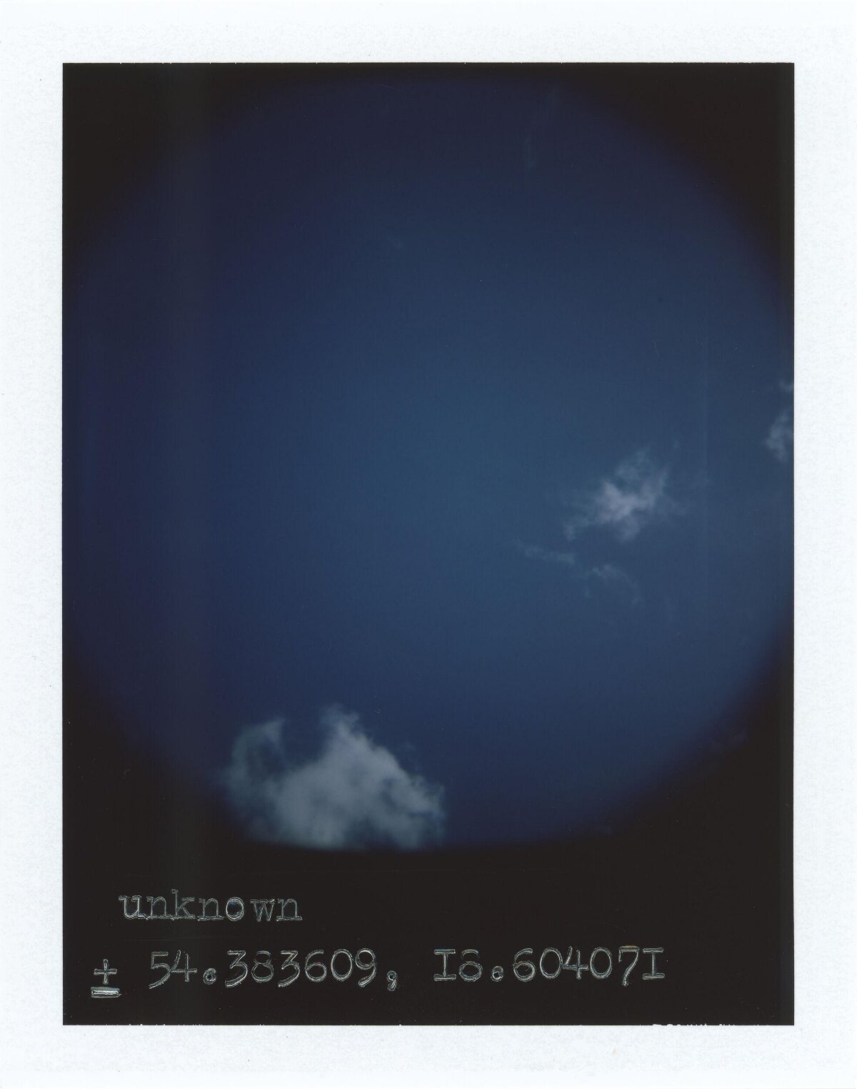 Deep Blue Sky With Scattered Clouds