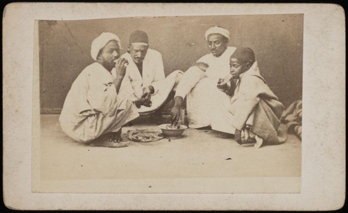 Four Men Sharing a Meal