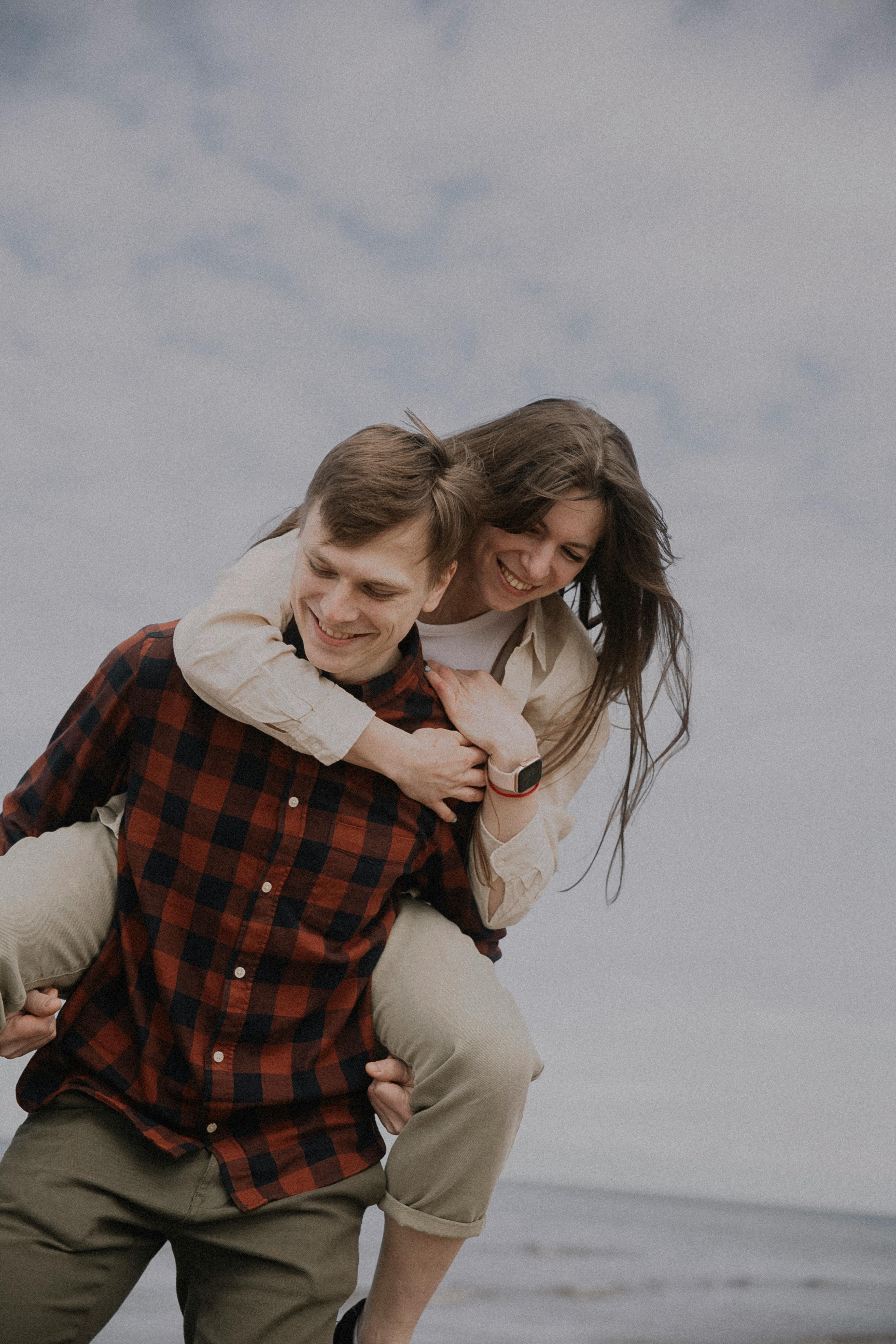 Couple on Piggyback Ride Outdoors